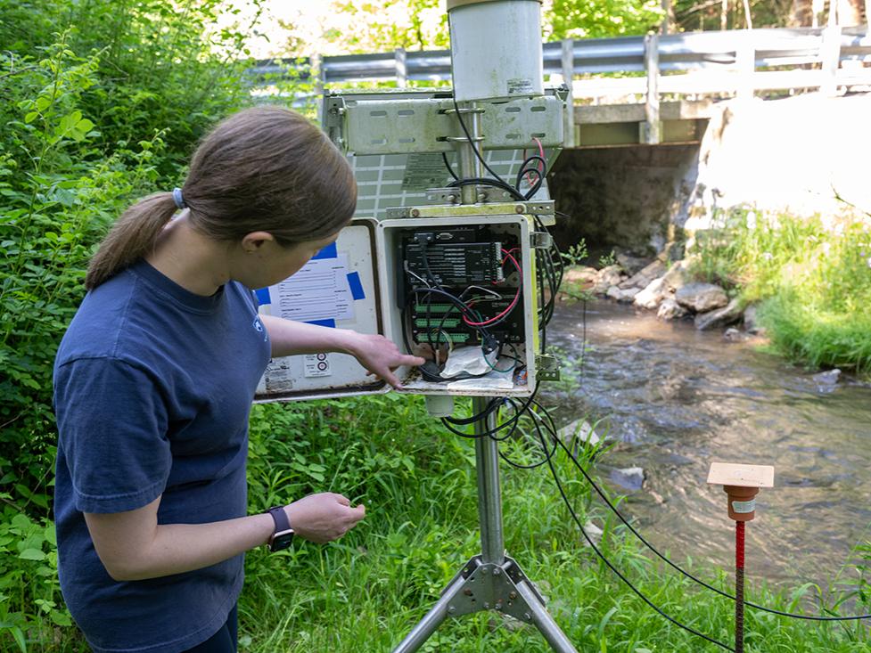 researcher looking into device