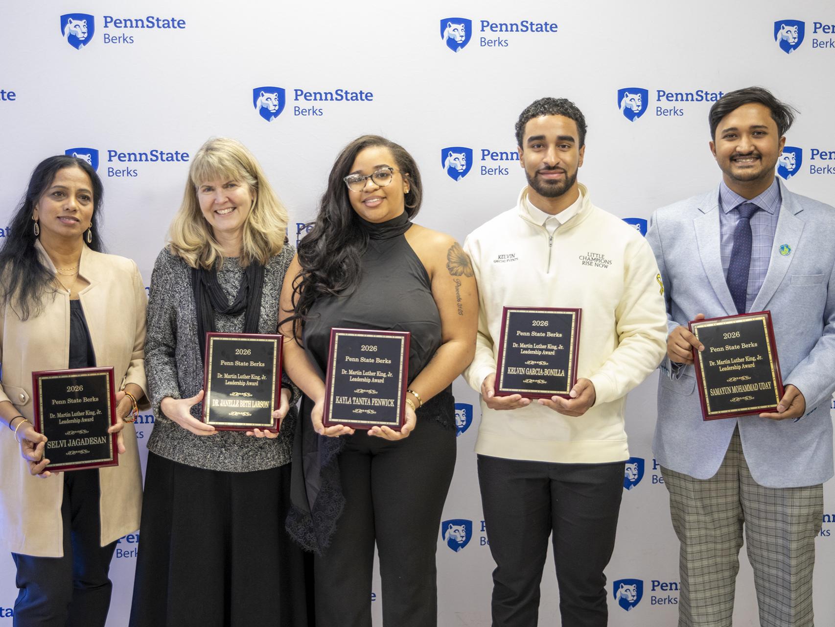 The honorees of the Martin Luther King Jr. award ceremony pose with their plaques.