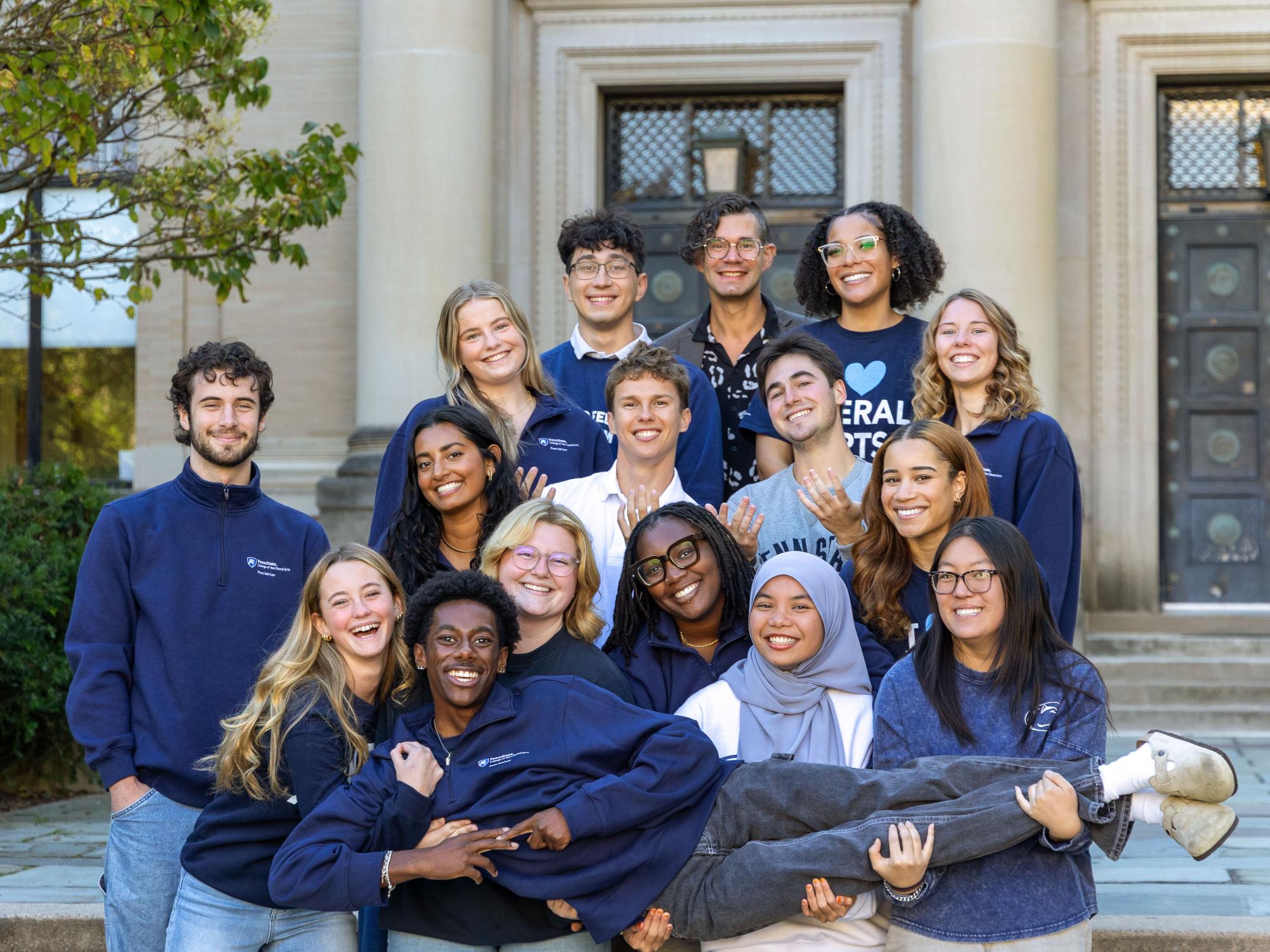 Alivia Peterson (second row, furthest to the right) stands with the rest of the 2025–26 Liberal Arts peer advisers outside Sparks Building.