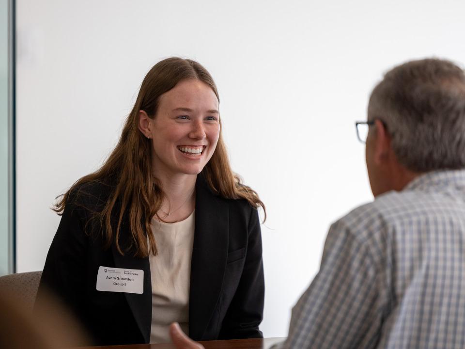 Avery Snowden speaks with Mark Jinks at the School of Public Policy’s Career Day in Washington, D.C. last year.