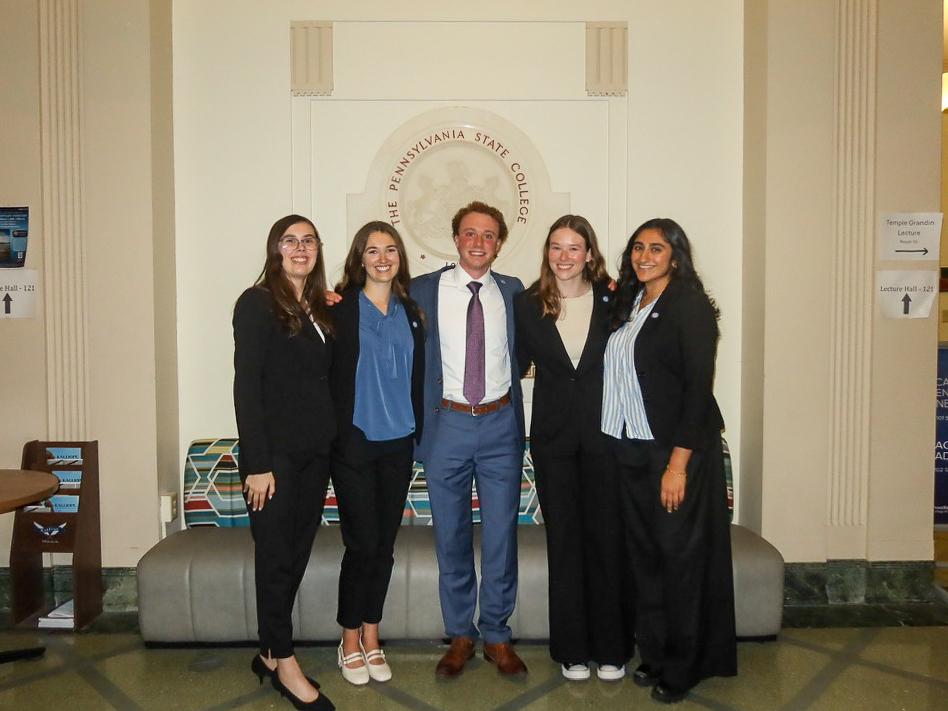 Avery Snowden, second from right, stands with four other members of the Liberal Arts Ambassadors 2024–25 executive board in the Sparks Building lobby.