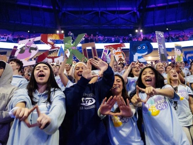 Crowd members form diamonds with their hands during THON Weekend 2026