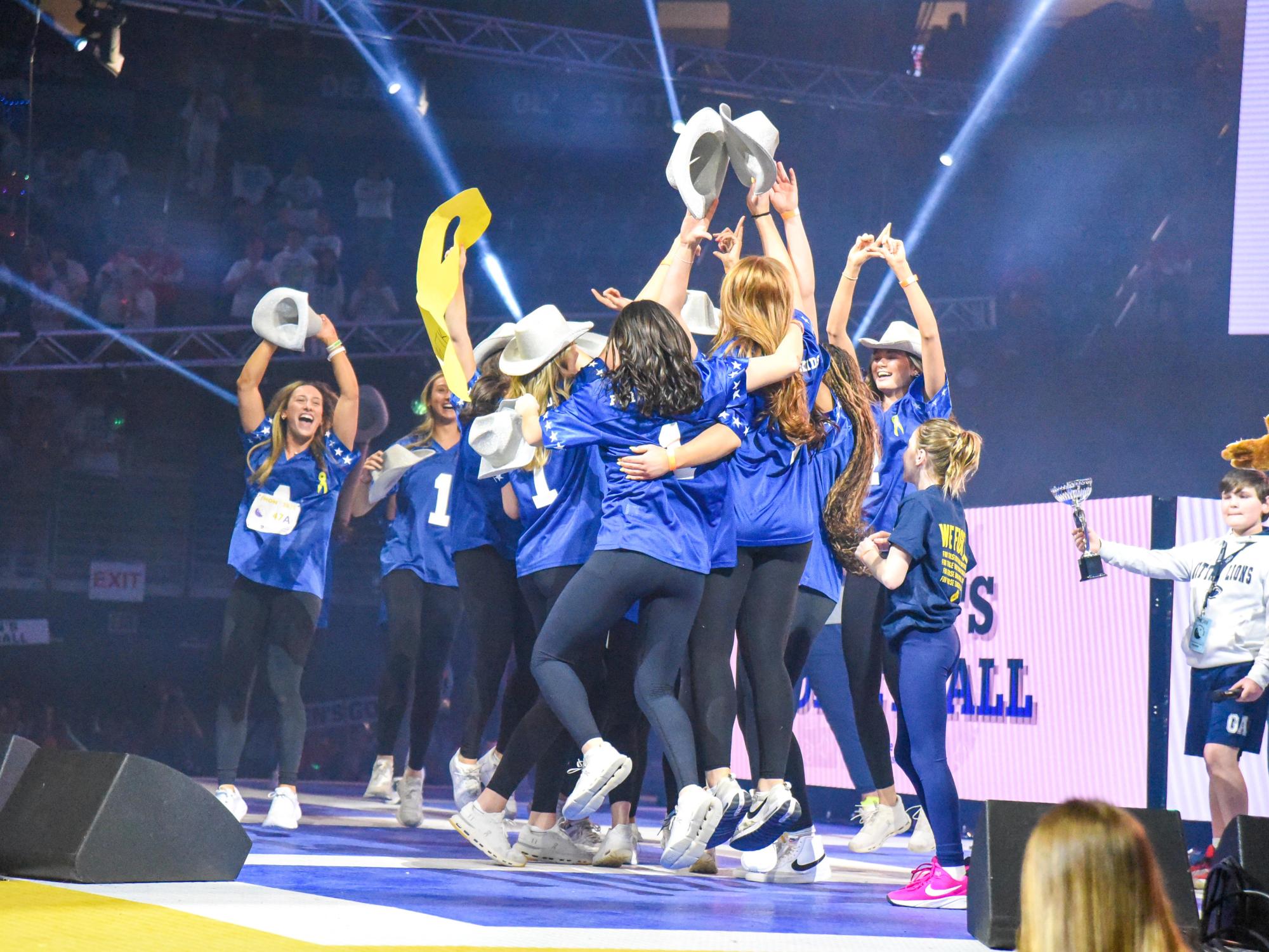 college athletes celebrating winning THON pep rally