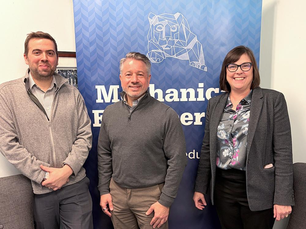 The president of ASHRAE (middle) stands with an associate professor of mechanical engineering (left) and the department head of mechanical engineering (right).