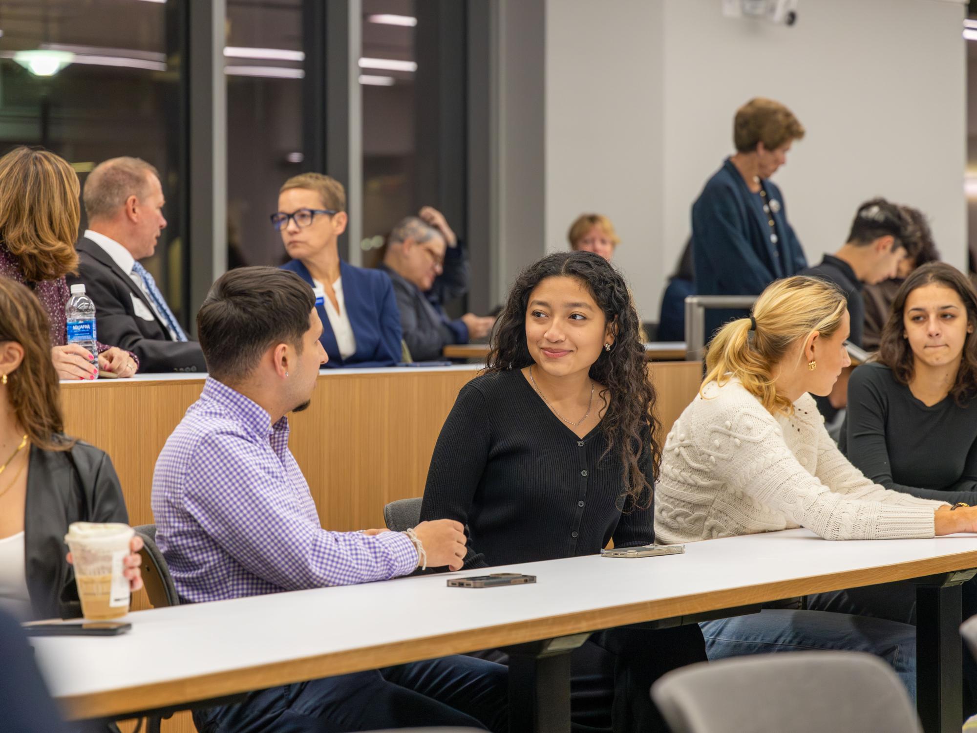 Two Penn State students talk at a Chaiken Scholars Reception.