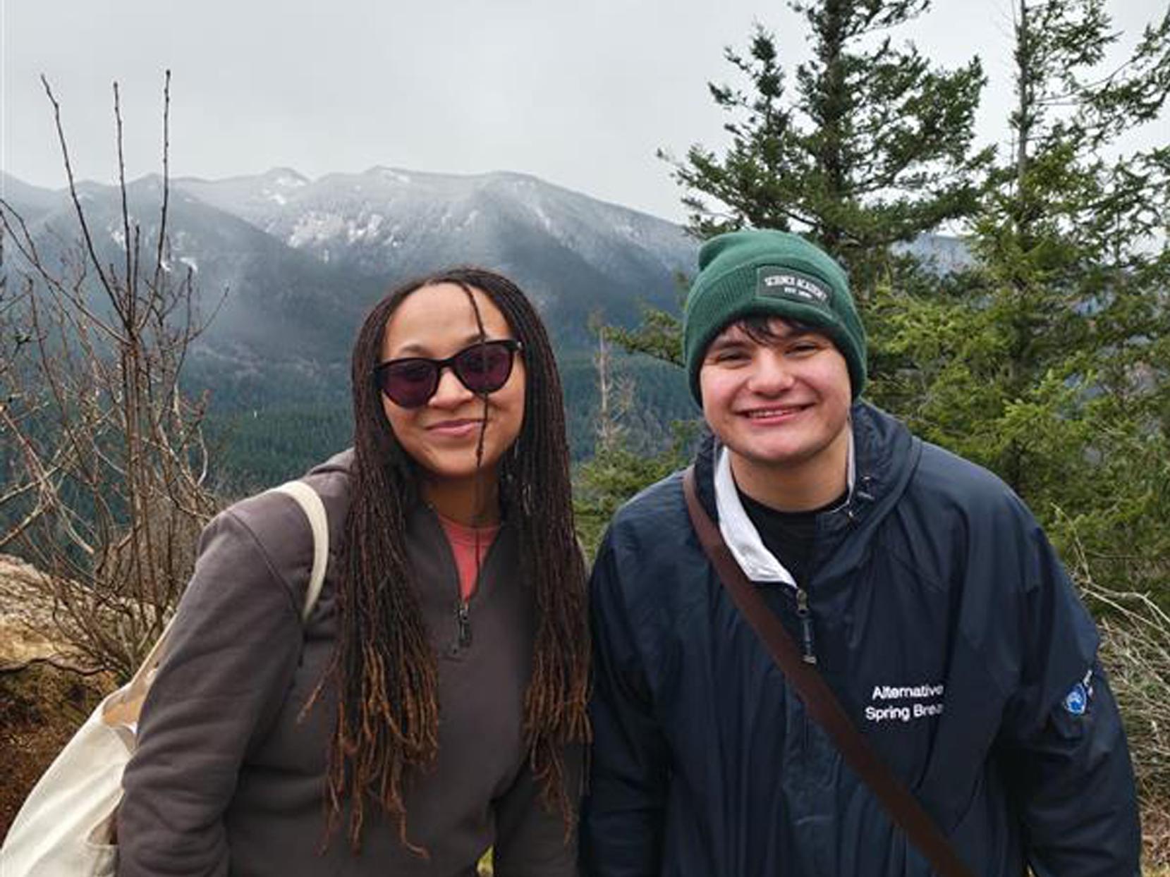 Kaleya Rivera-Pena and Adrian Dulgheru in front of a mountain