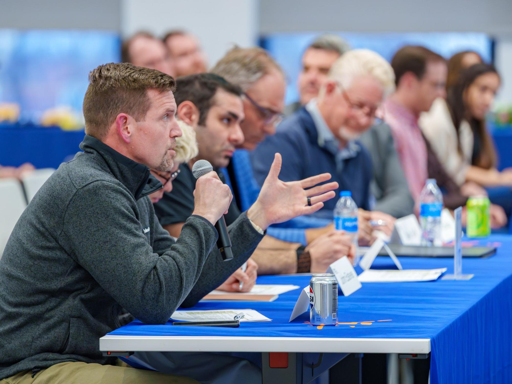 several people seated at conference room table
