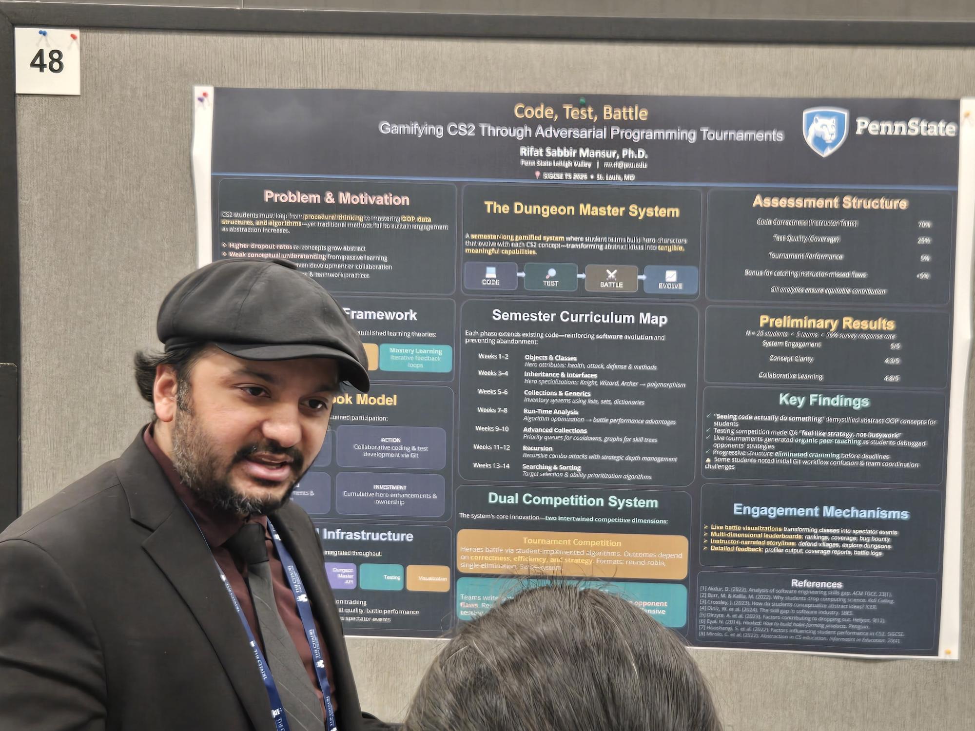 man standing in front of a poster speaking