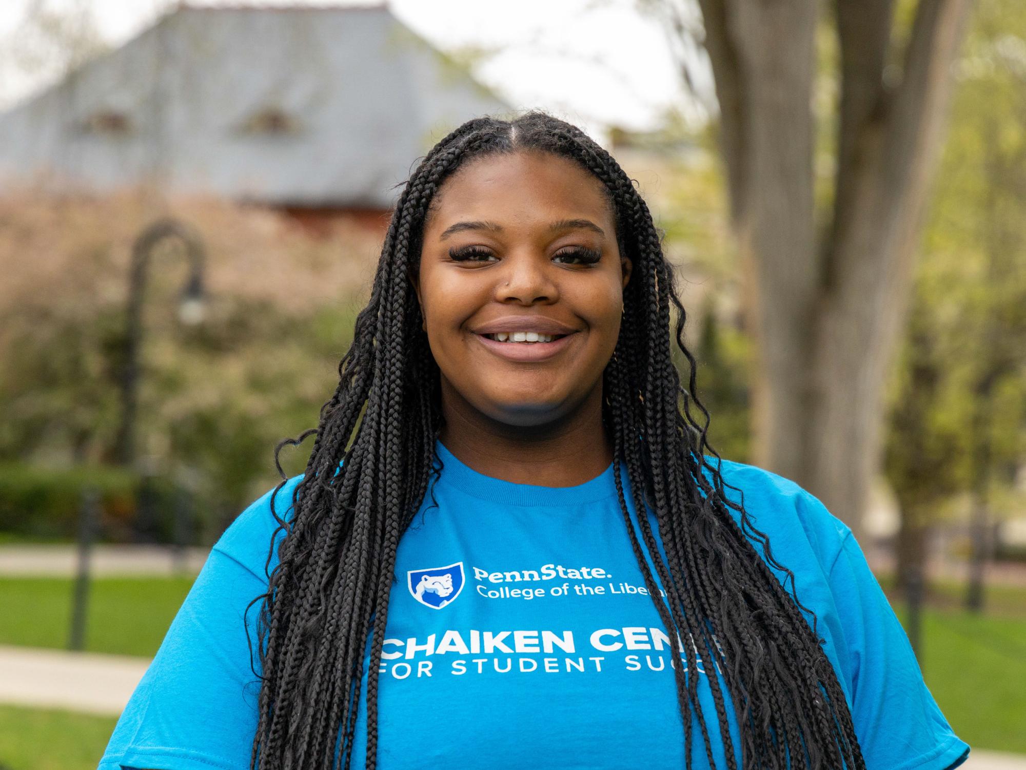 Trinidy Manison wears a blue Chaiken Center shirt.