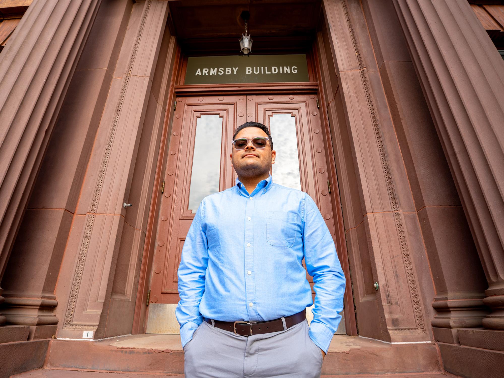 man with hands in pockets and sunglasses