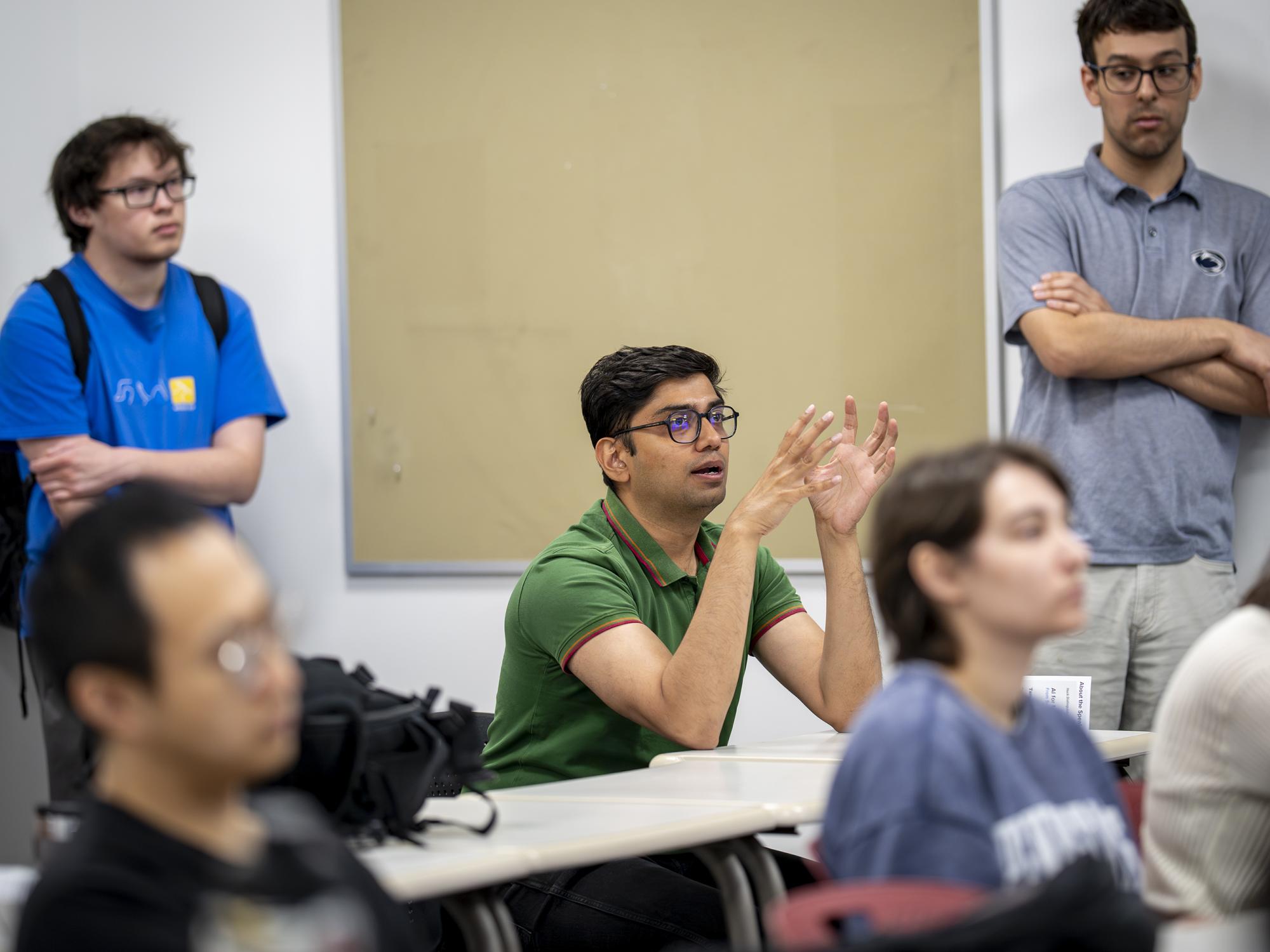 An attendee asks a question during a Distinguished Lectures in Life Sciences presentation. April 24, 2026.