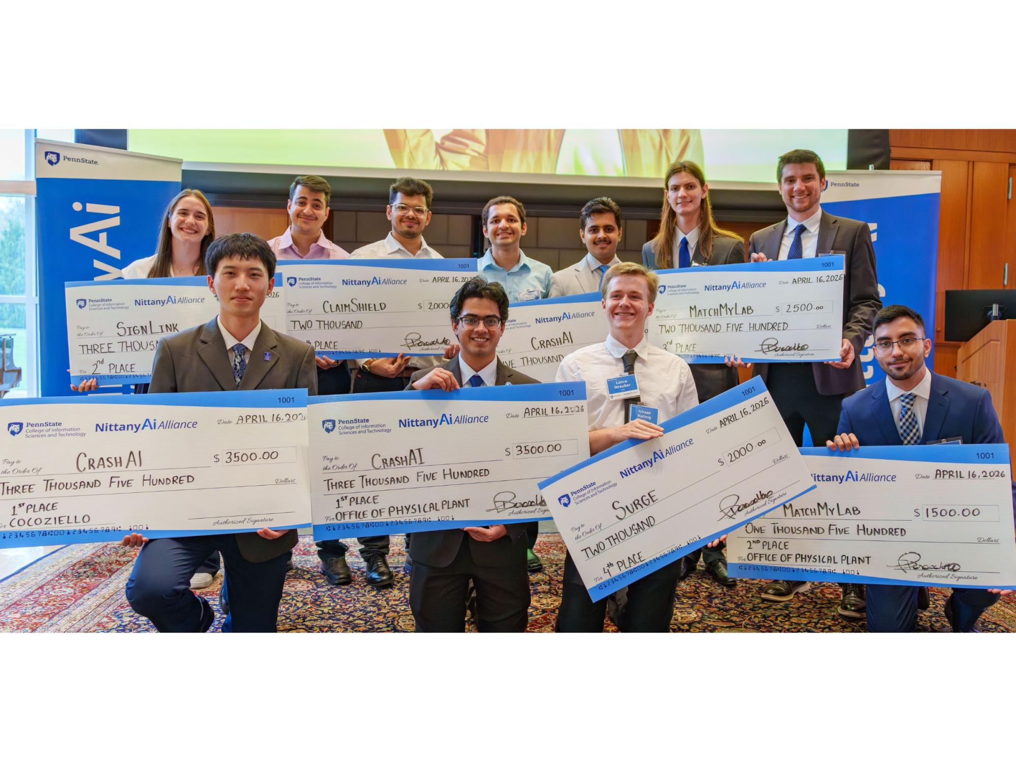 a bunch of college students holding oversized checks
