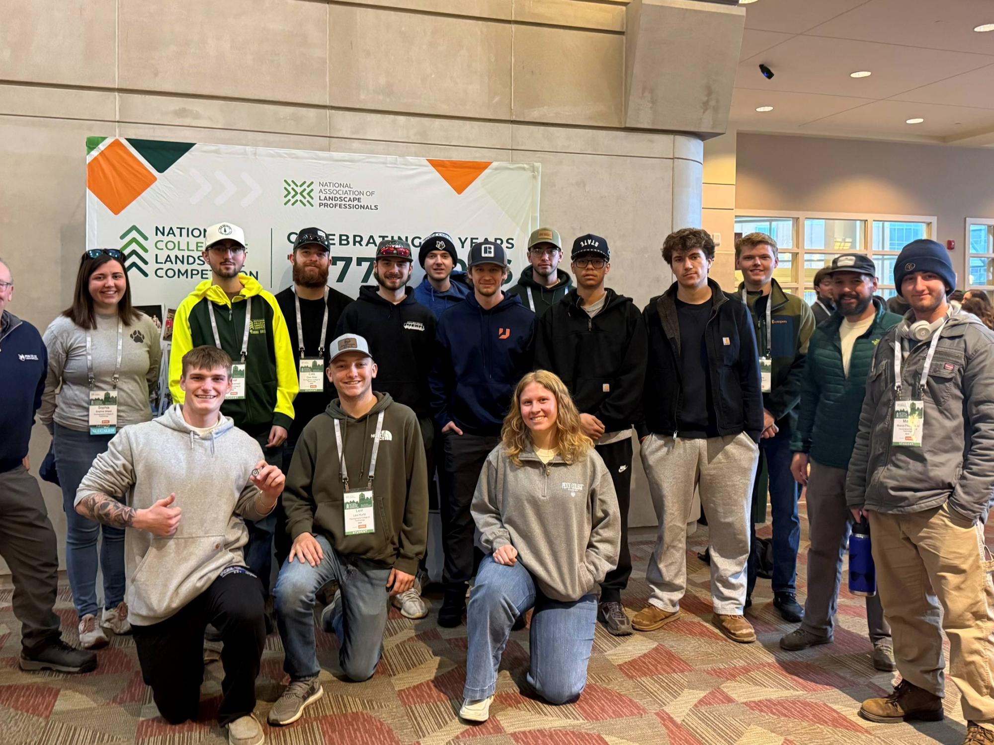 A large group of people pose for a photo.