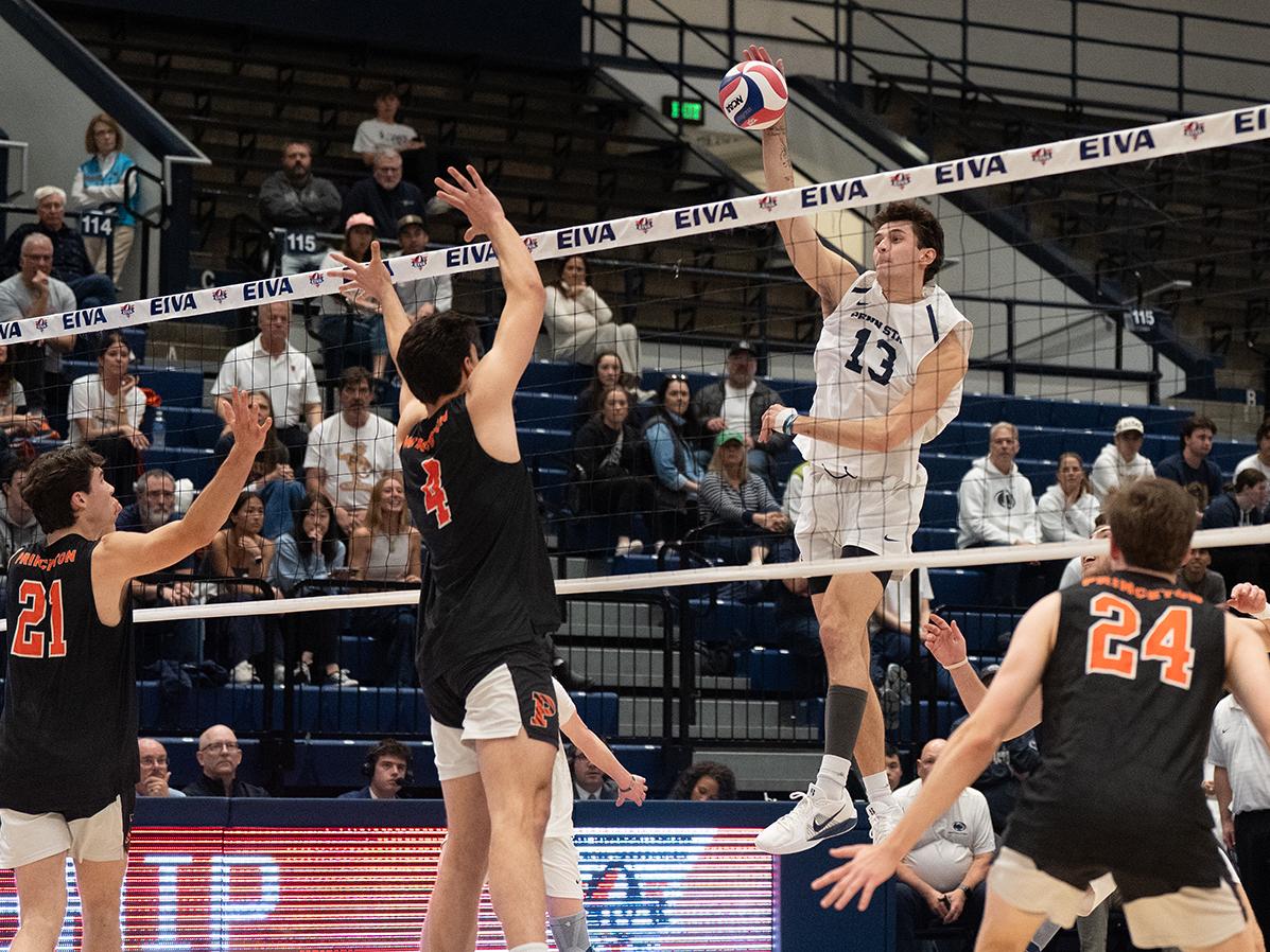 Man spike ball over net