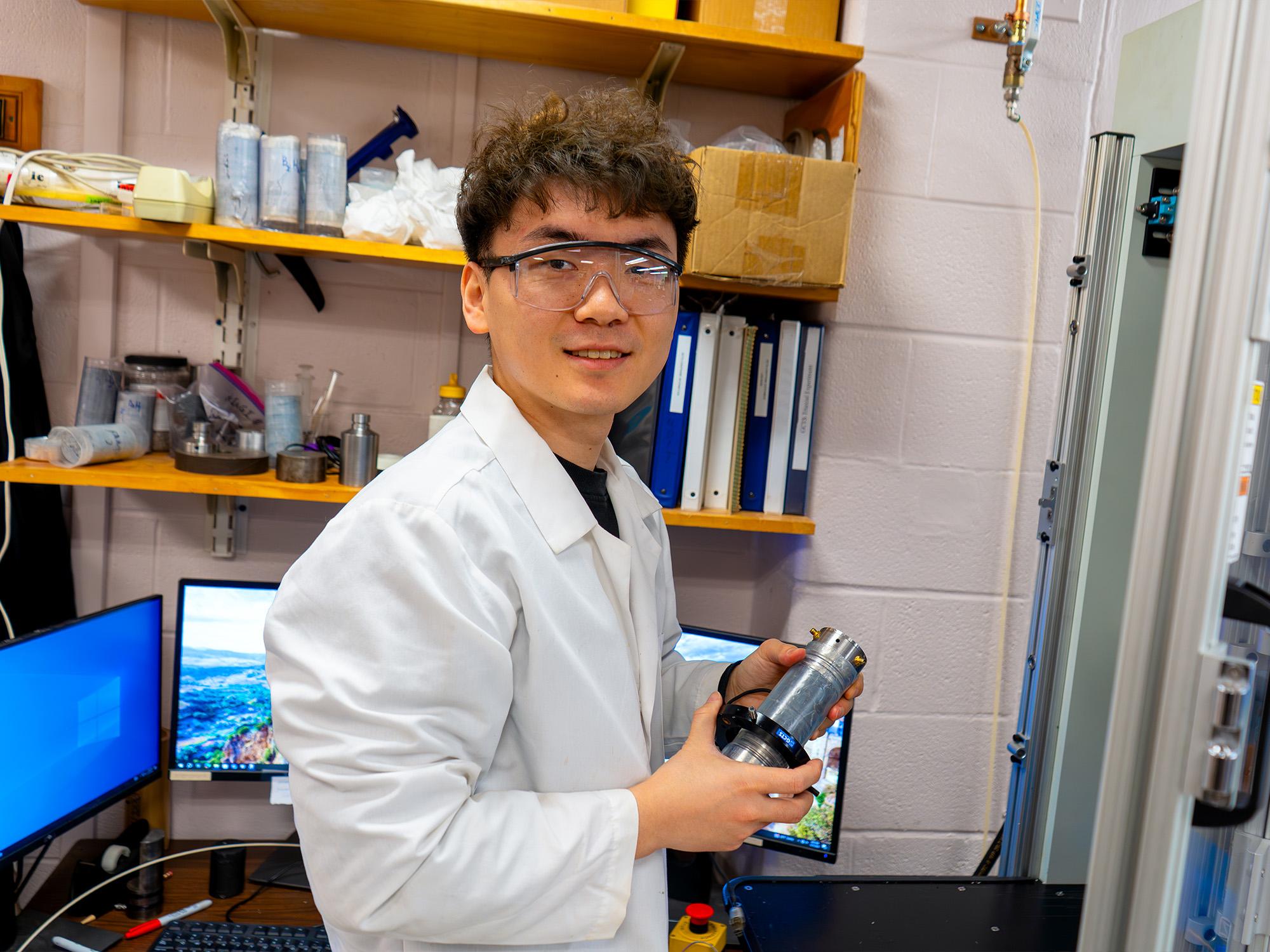 person holding equipment in lab