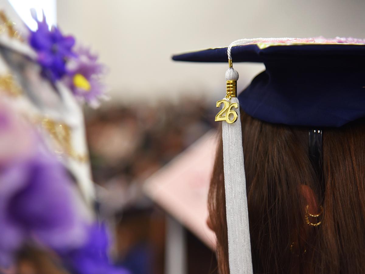 Close-up of a Penn State Altoona graduate wearing a cap with a 26 tassel at spring 2026 commencement