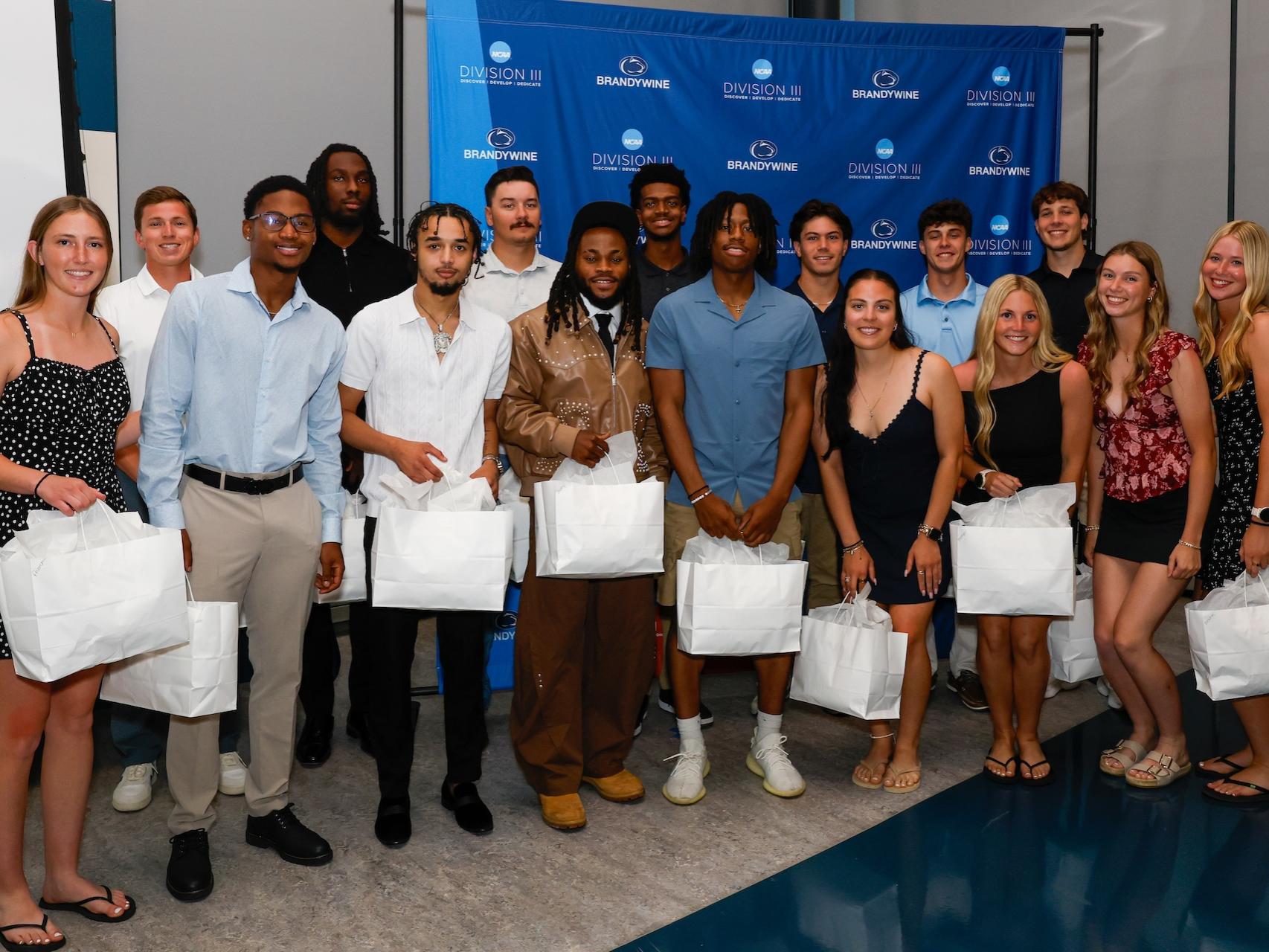 a group of students holding bags