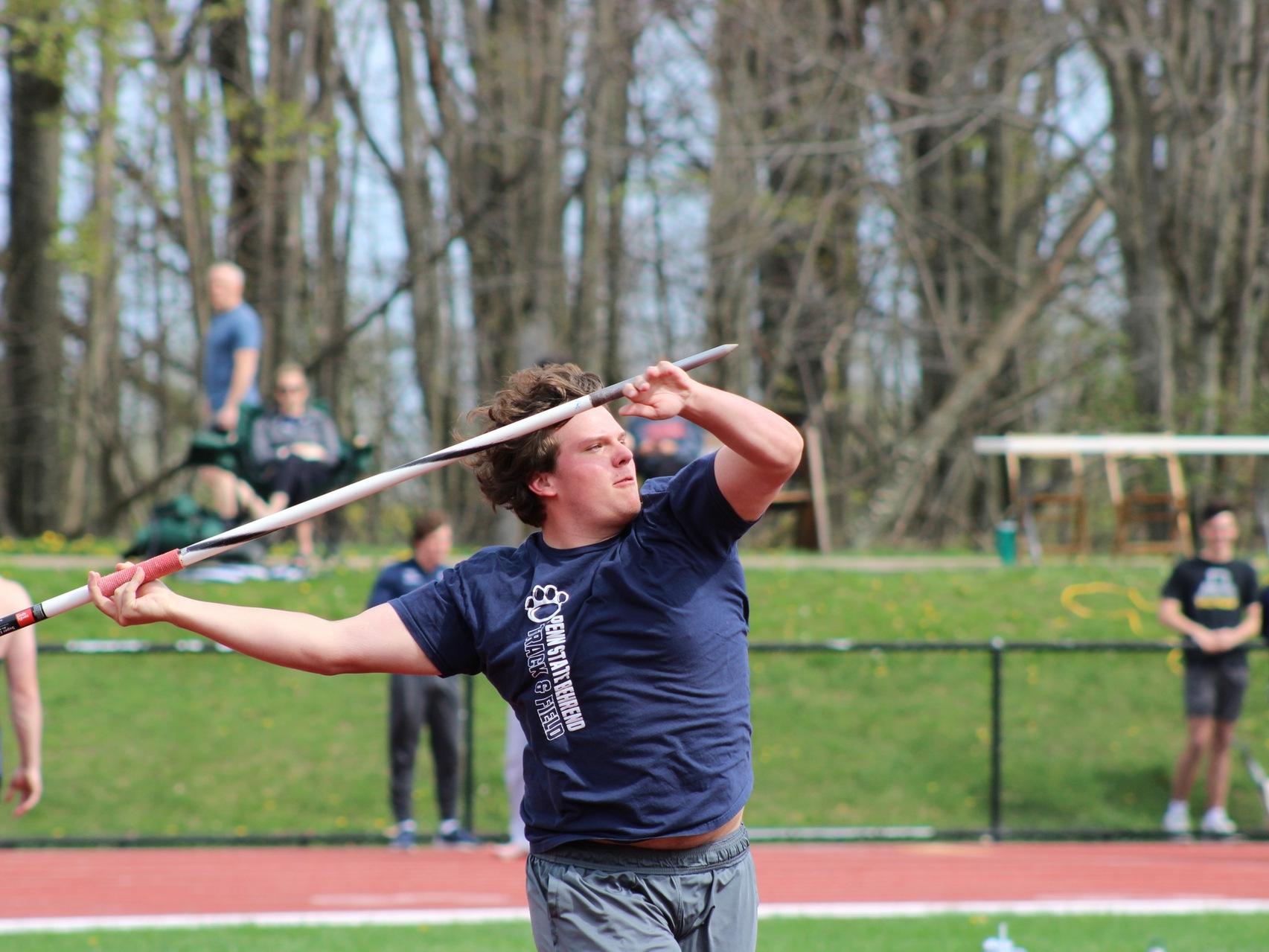 Penn State Behrend student-athlete Charlie Motter throws the javelin.