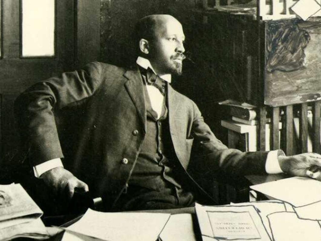 Photo from 1909 showing a Black man sitting at a desk