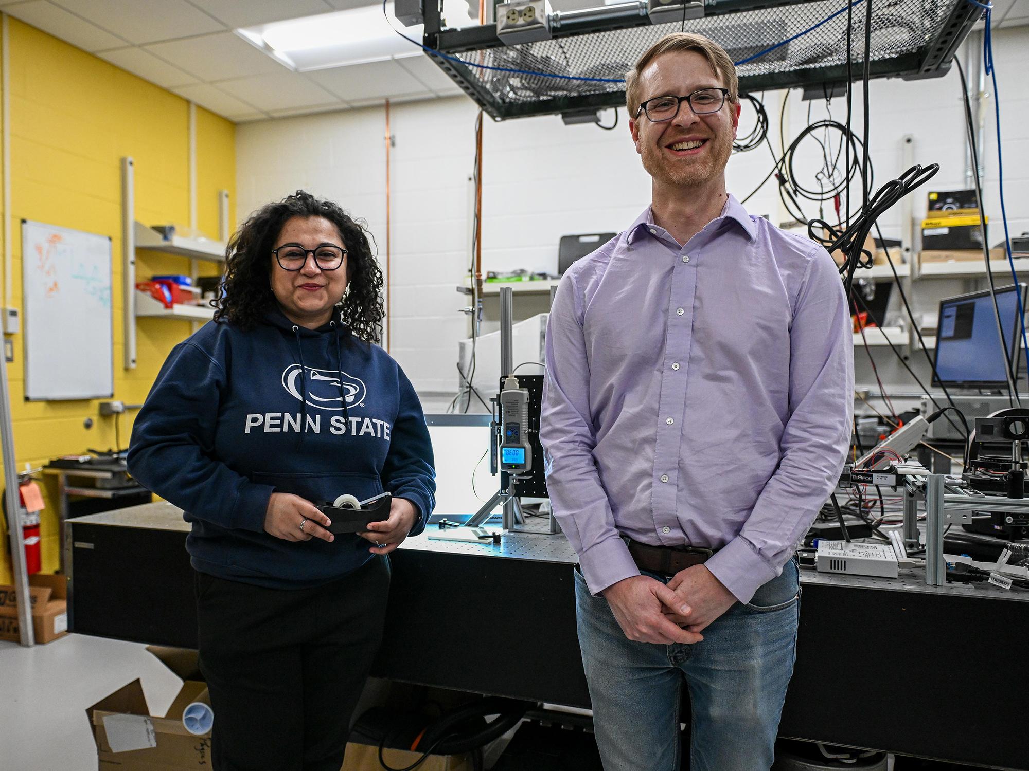 Sebanti Chattopadhyay and Nathan Keim standing in lab.