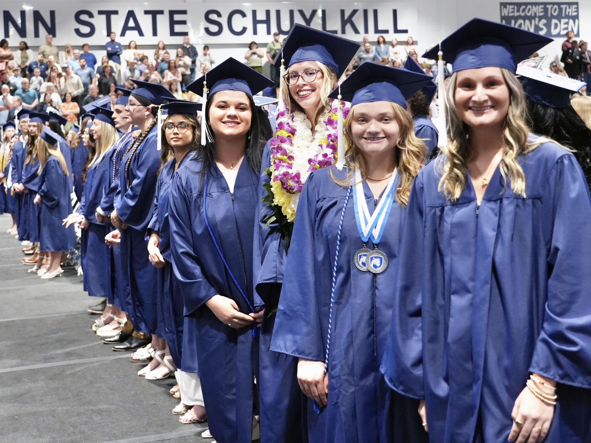 Students pose together at Penn State Schuylkill's 81st commencement ceremony.