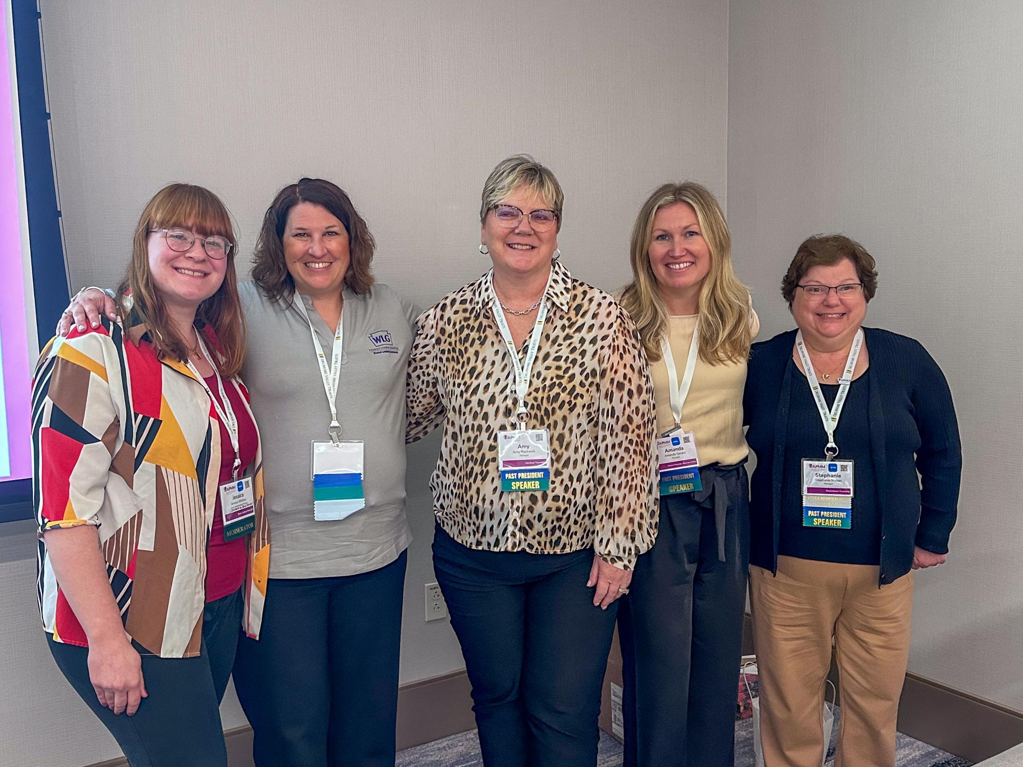 Jess Whitley, Amy Farkas, Amy Rockwell, Amanda Serock and Stephanie Mason smile after the panel session on building the pipeline for women in local government.