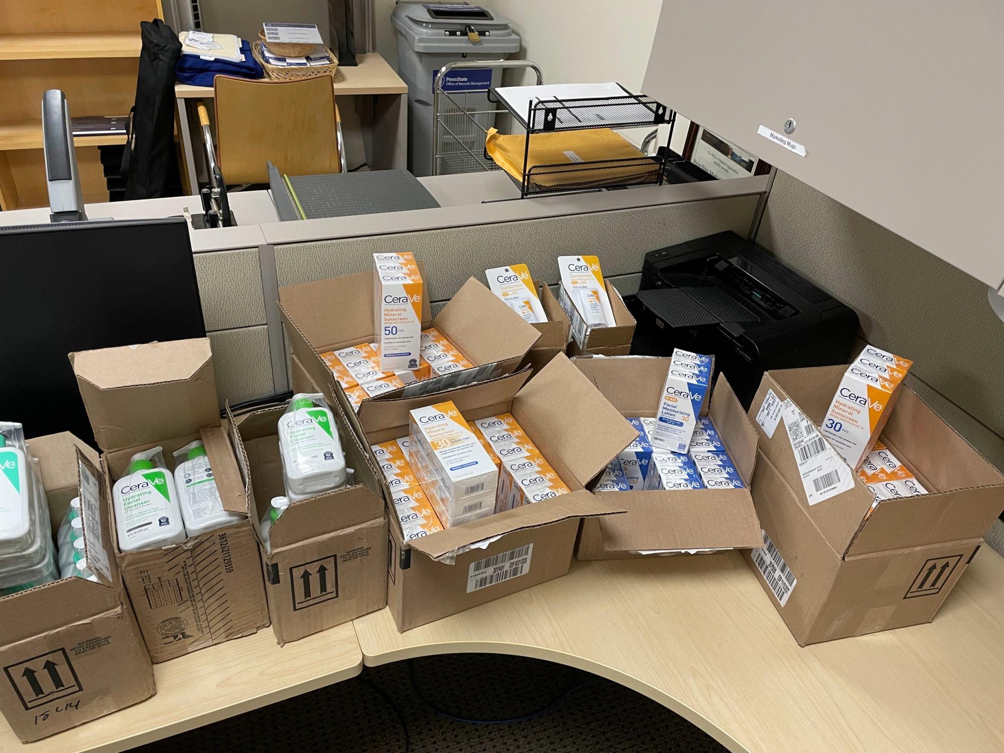 Boxes of skincare products in an office