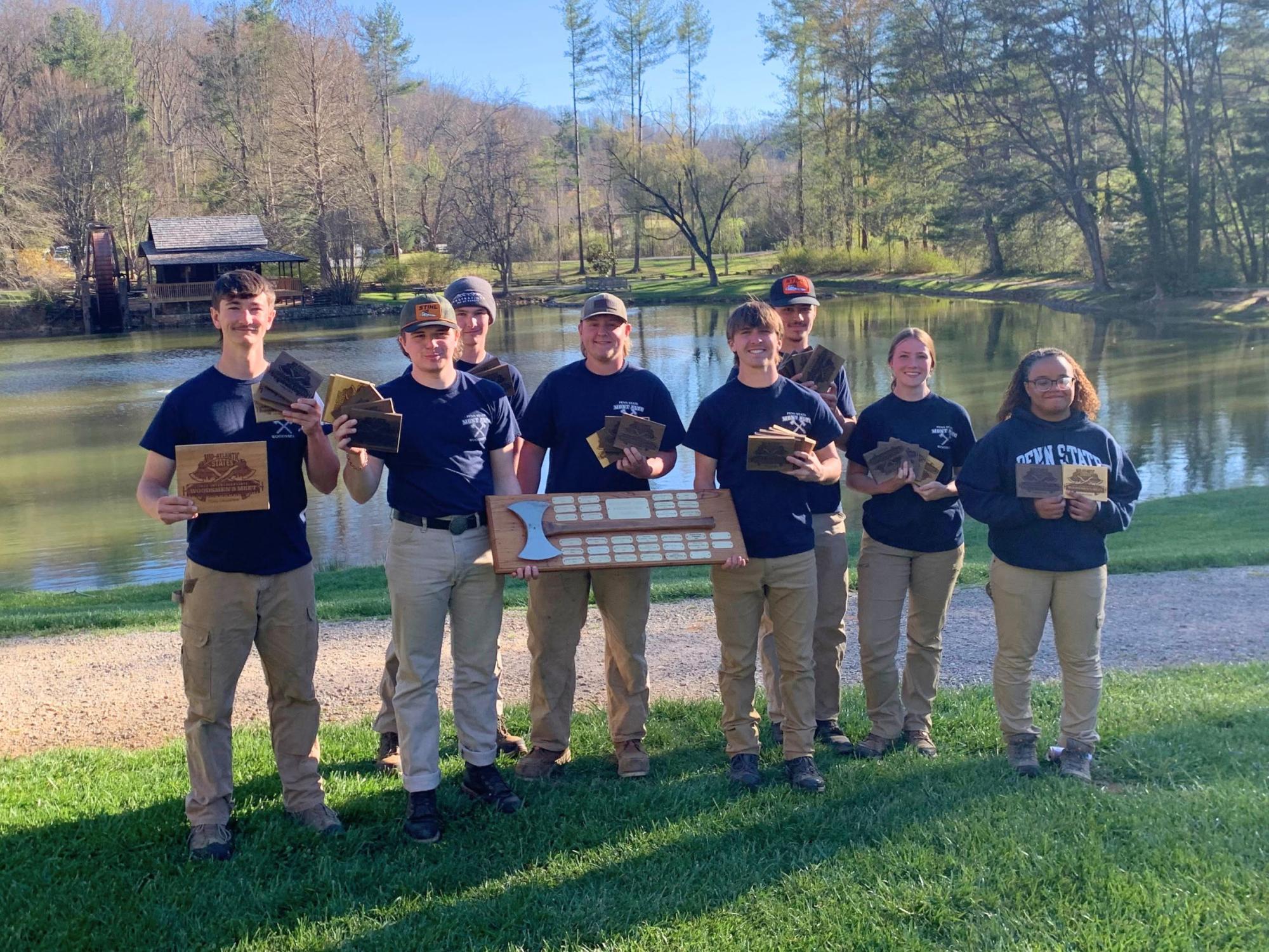 Penn State students gather together to display their 1st place award. 