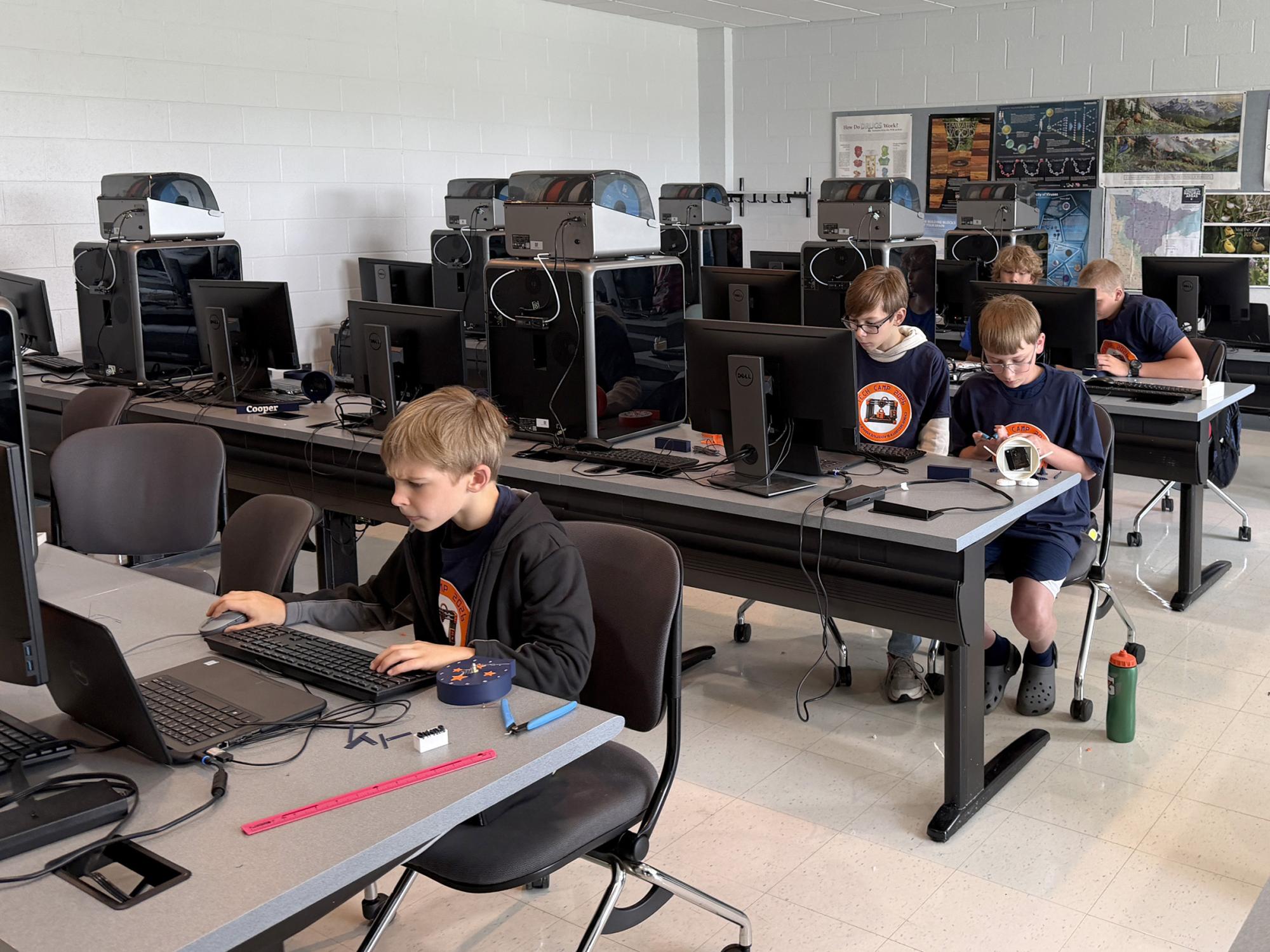 Students from DuBois Area School District who attended the Summer Tech Camp, hosted by Penn State DuBois and the NCPA LaunchBox powered by Penn State DuBois, work through a 3D printing and prototyping exercise in one of the computer labs at Penn State DuBois.