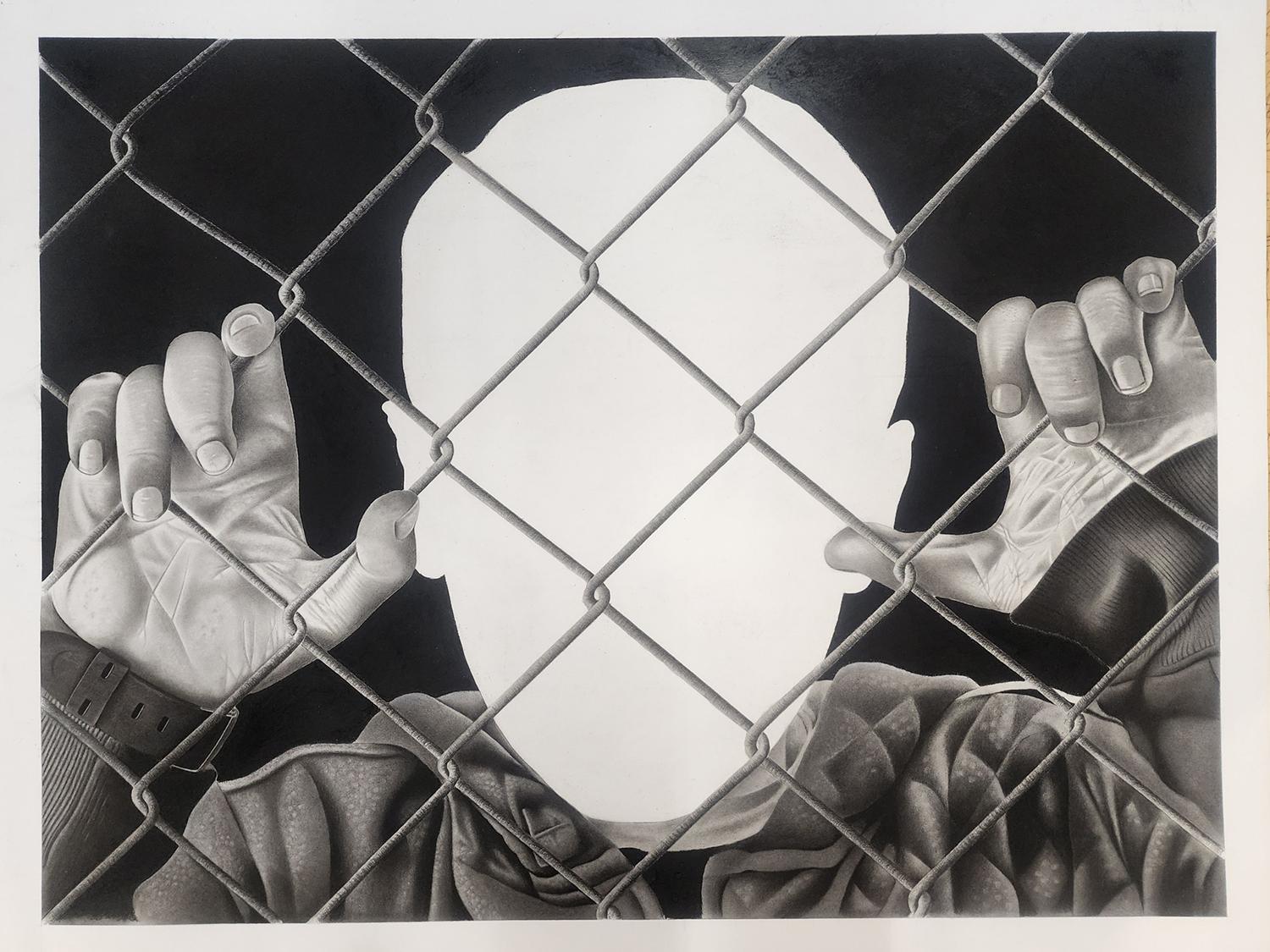 Charcoal and graphite drawing of a person gripping a chain‑link fence with both hands whose face is completely blank, rendered as a smooth white void, which contrasts sharply with the dark background and detailed shading of the hands and clothing. The composition evokes themes of confinement, anonymity, and erasure, using the stark absence of facial features to highlight loss of identity and human separation.