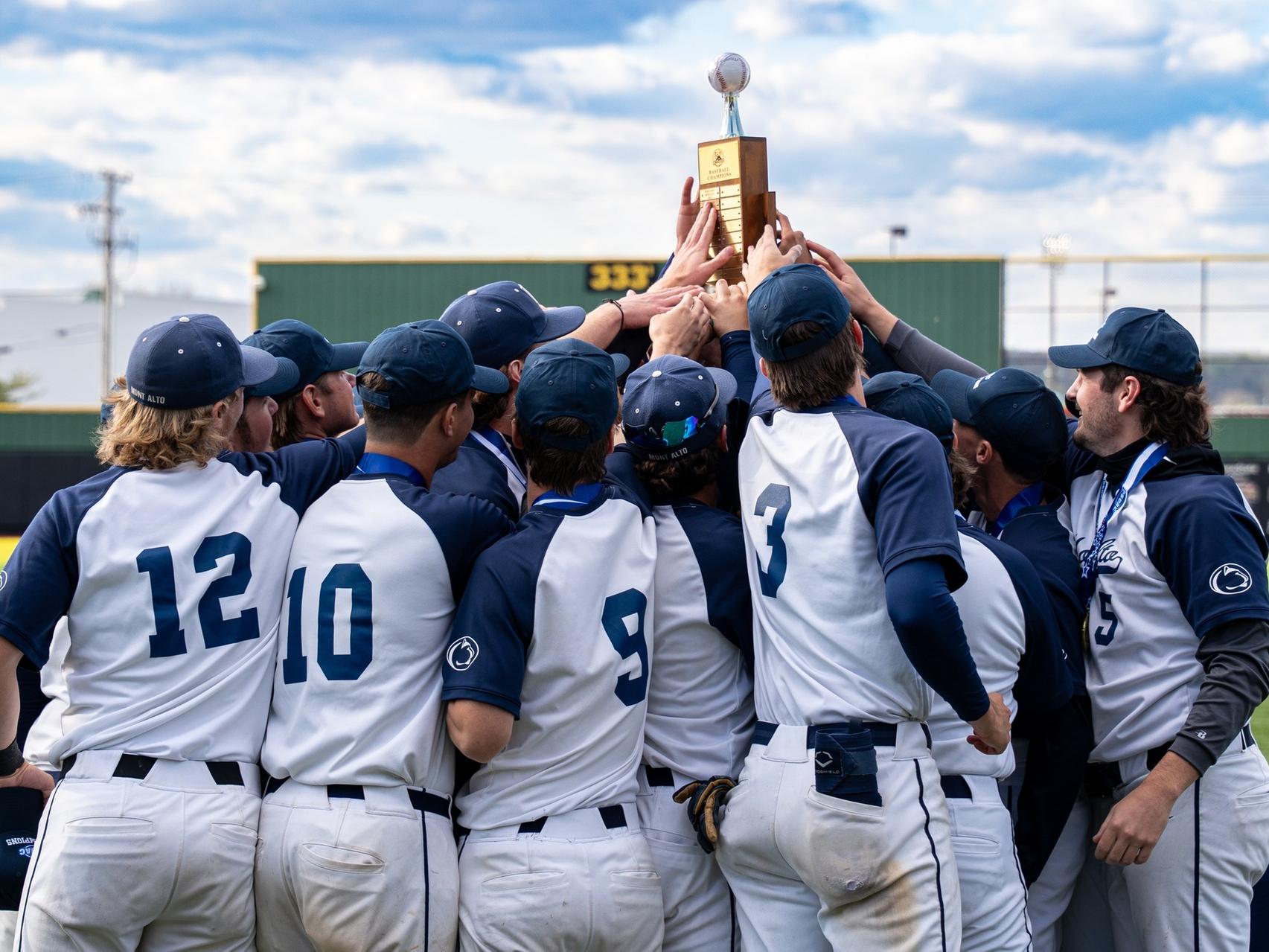 A group of players are hold a trophy.