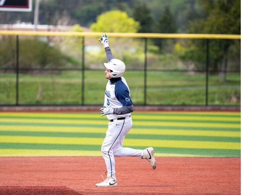 Baseball player running the bases.