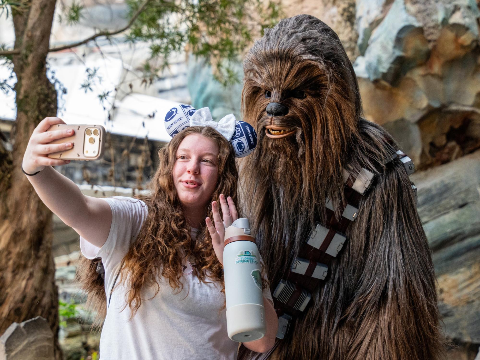 A Penn State York FBLA student takes a selfie with Chewbacca.