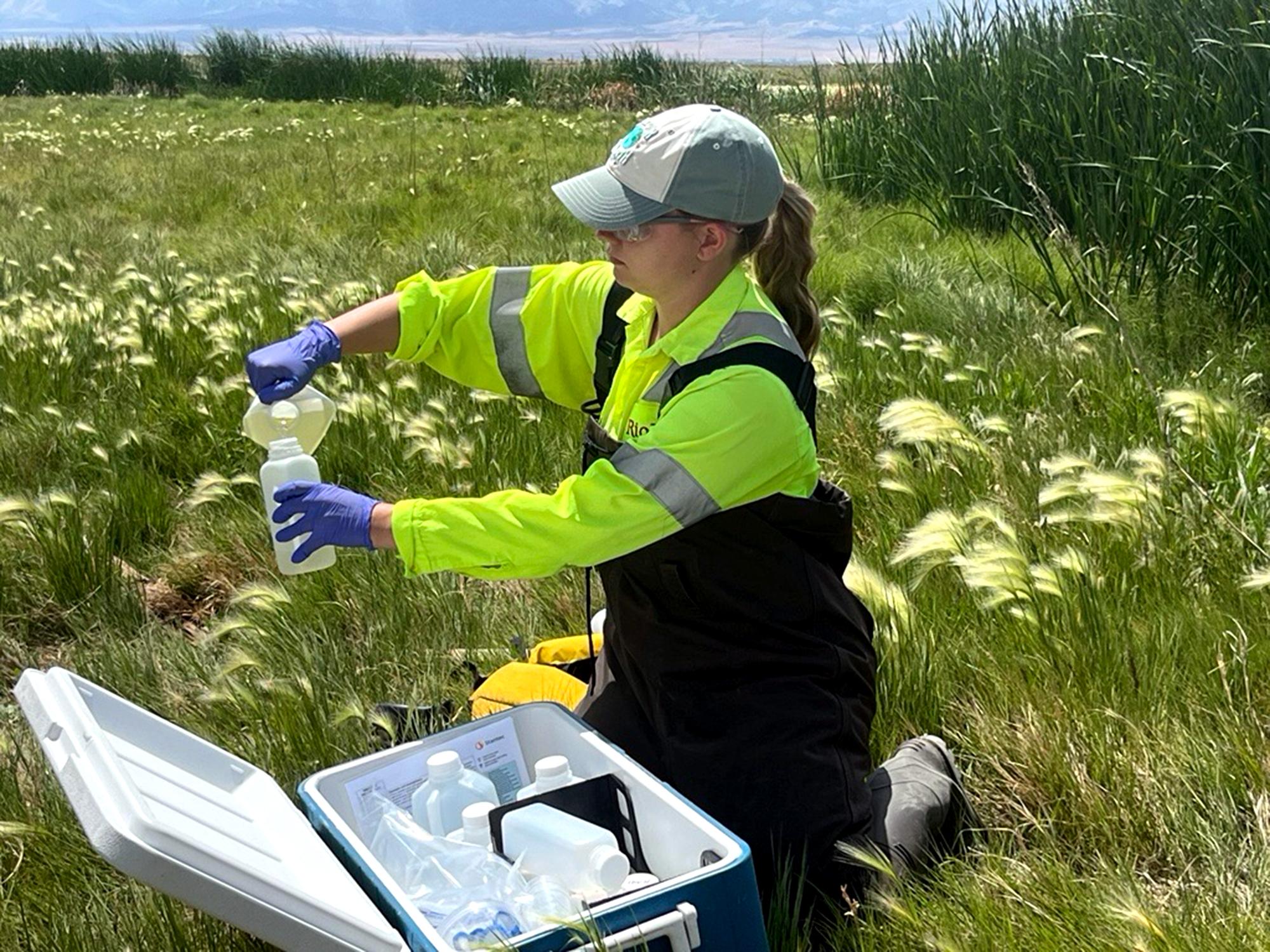 Moran takes a water sample