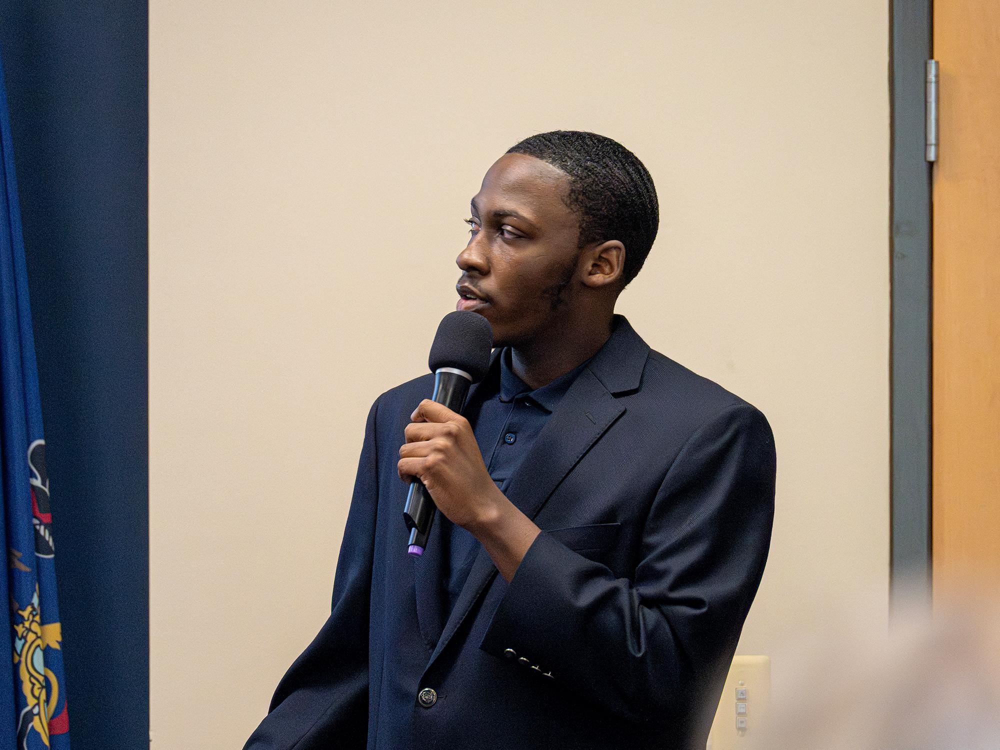 A person speaks at a podium