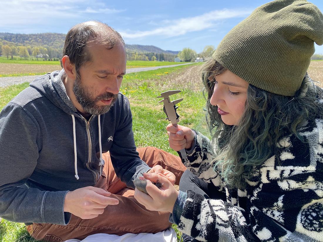 researchers with little bird