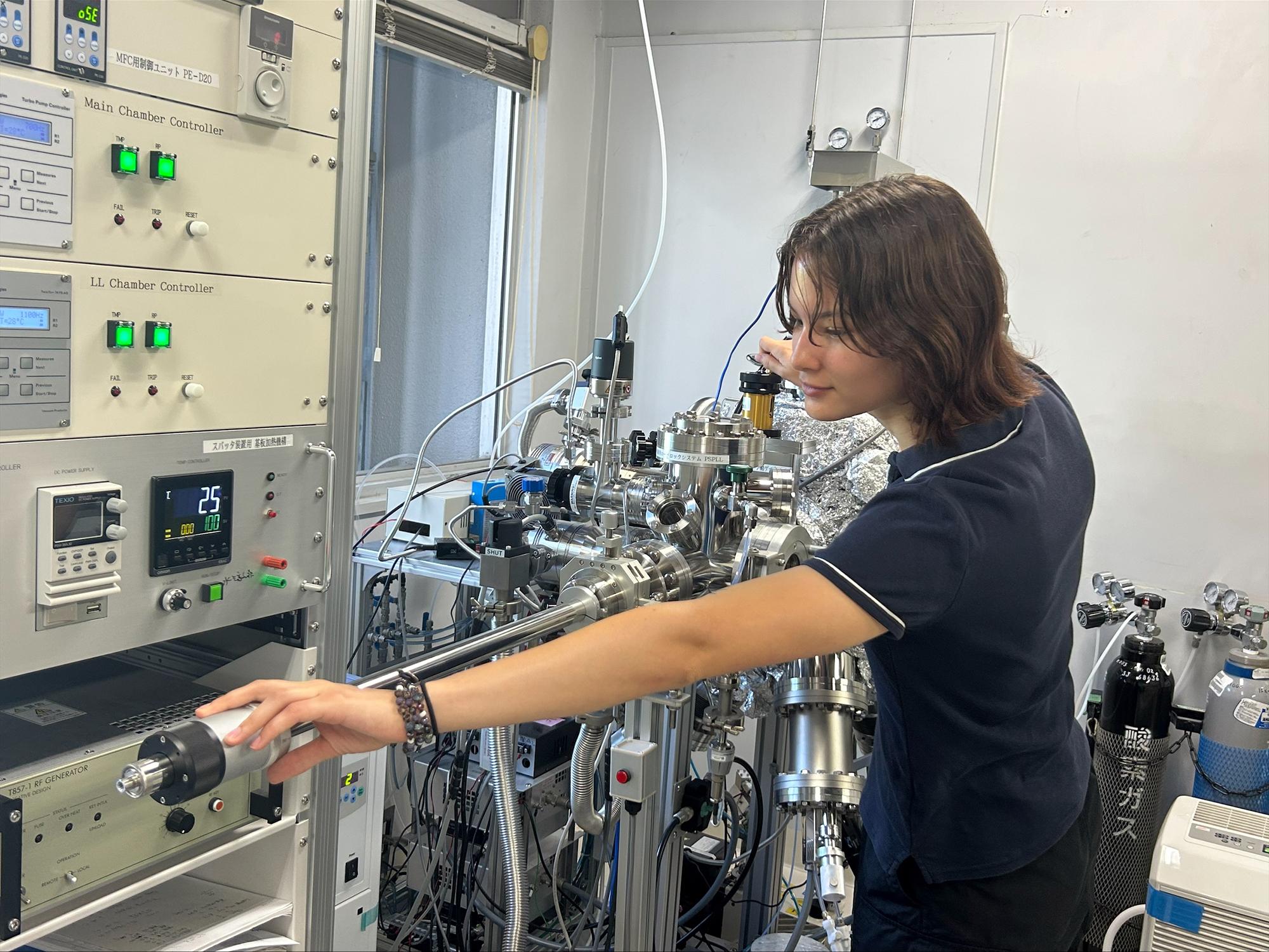 Kaylin Lamaute uses lab equipment in Japan.