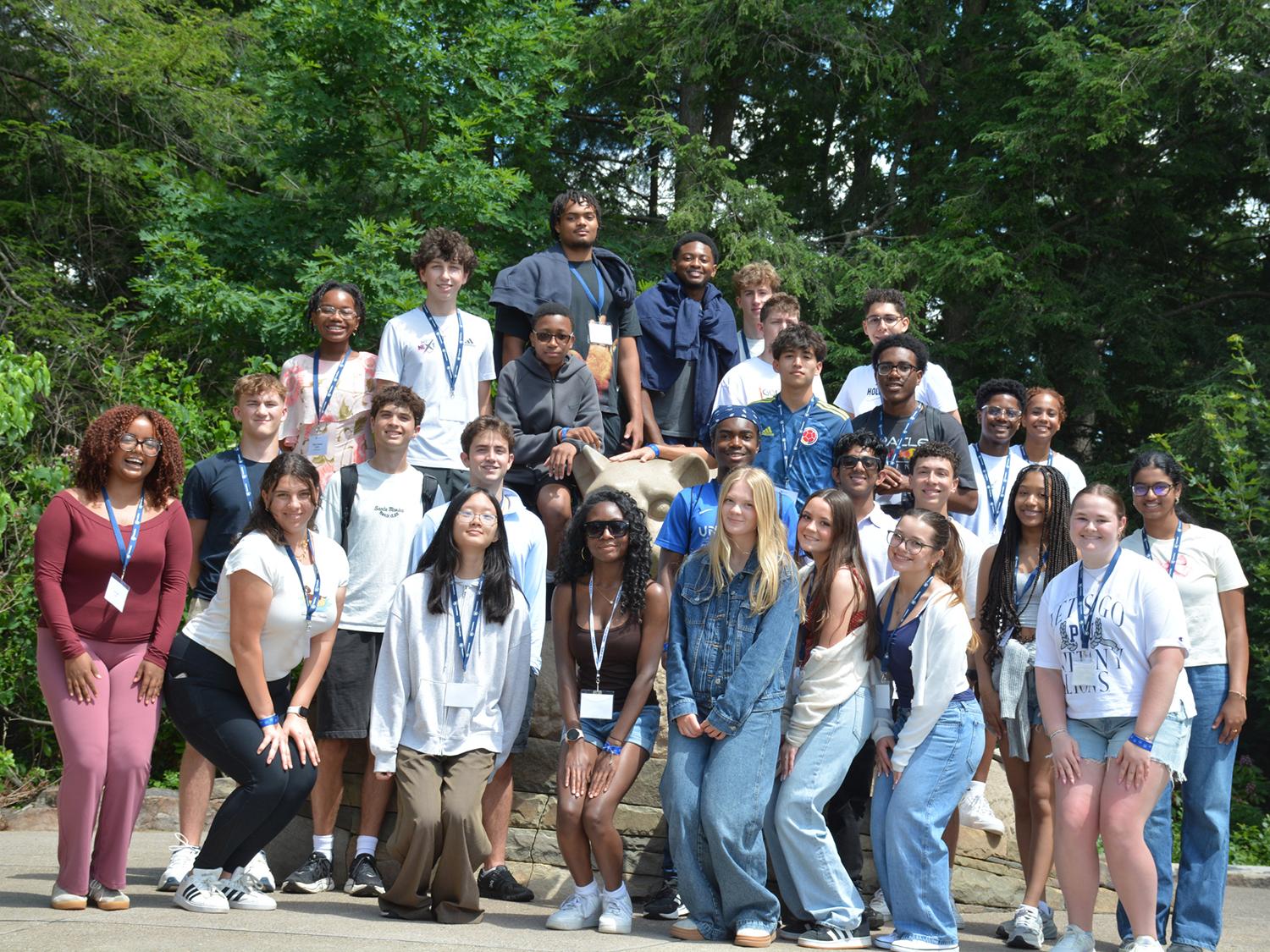 The 2026 BOSS cohort of 28 students poses at the Nittany Lion Shrine
