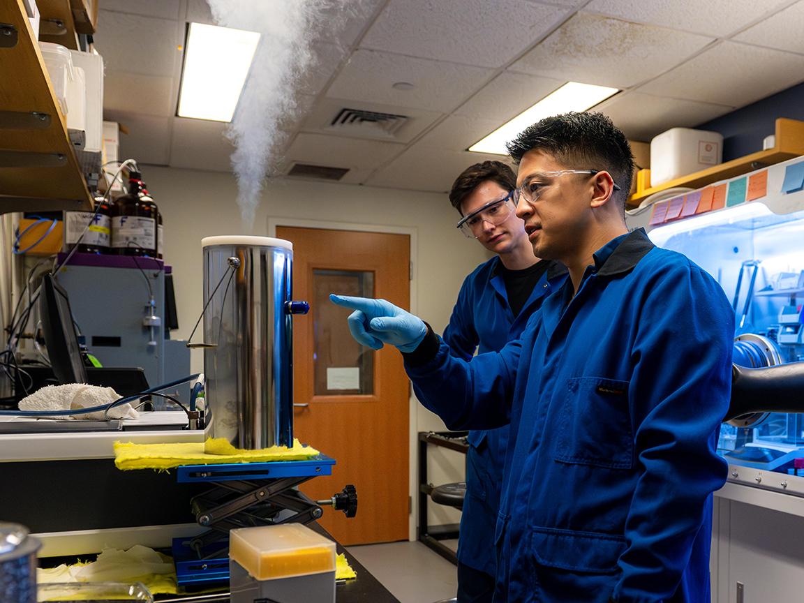 Chemistry researchers working in lab.