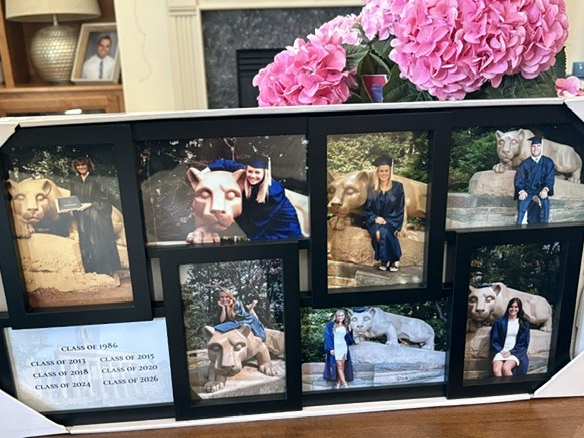 A framed photo displaying graduation photos from across the Mullin family