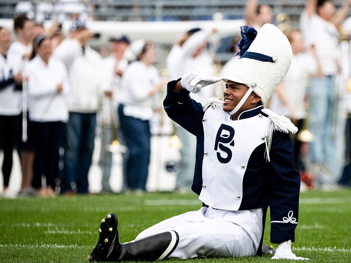 Drum major salutes crowd