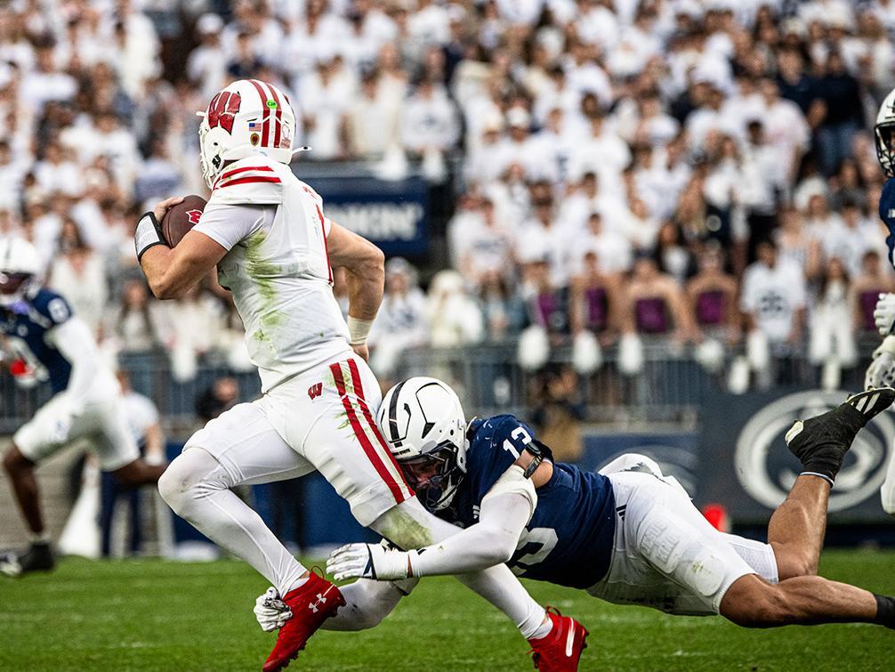 Player tries to tackle quarterback