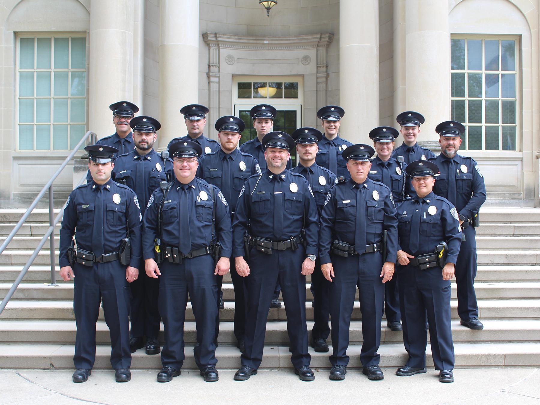 A group of people in uniform pose for a group photo