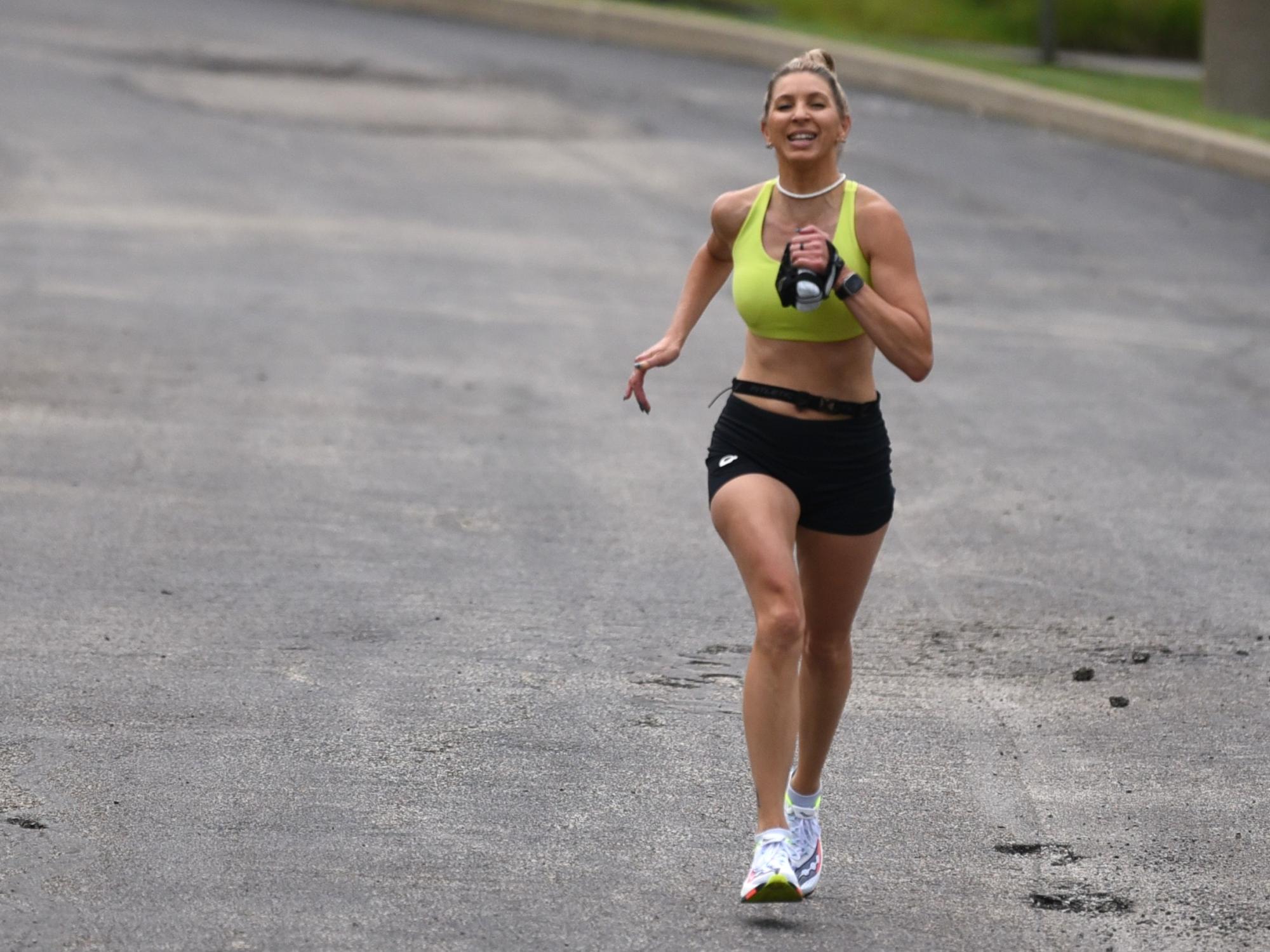 A woman finishes the Run for Women 5K at Penn State Behrend.
