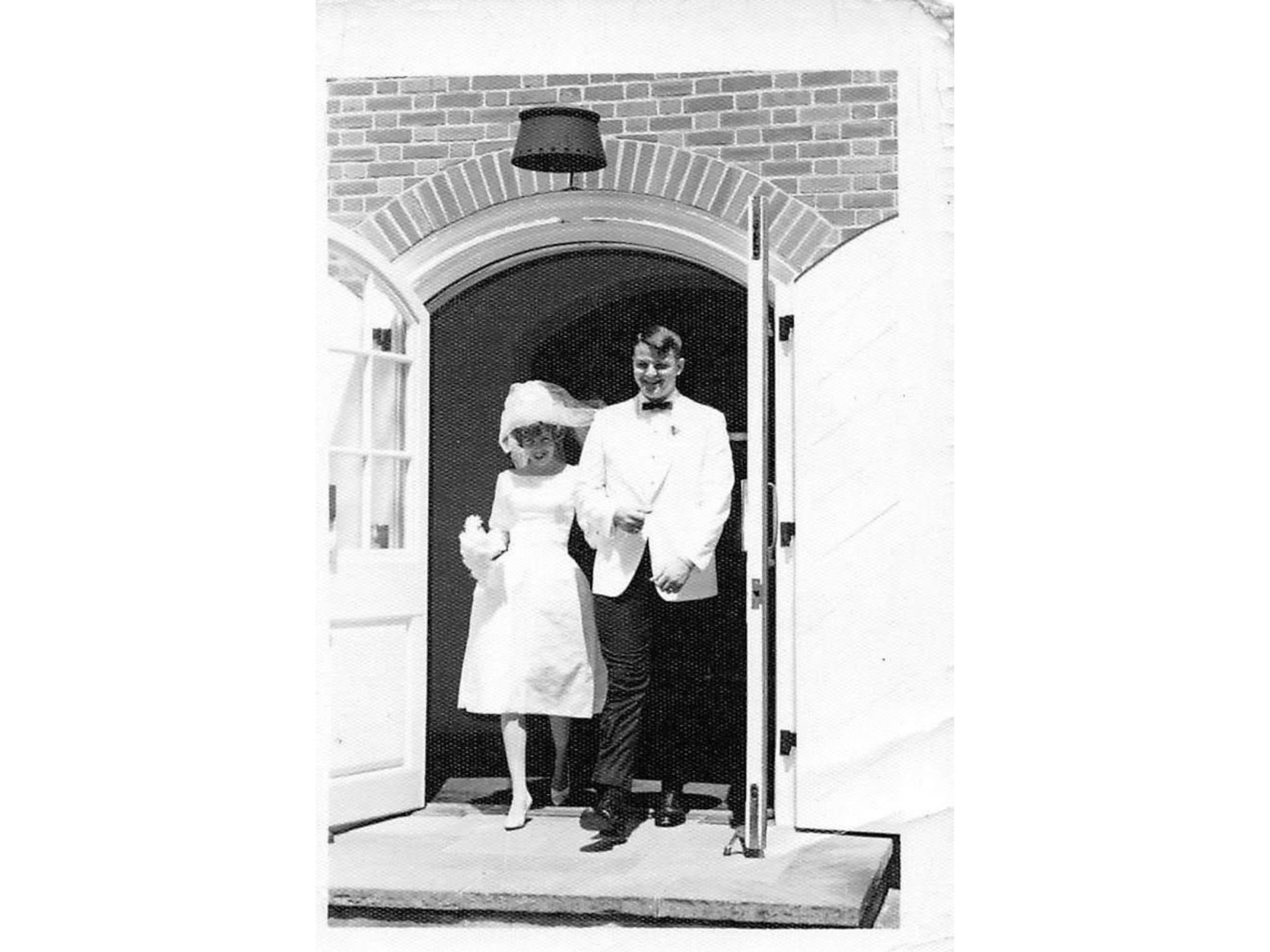 bride and groom exiting wedding venue in the 1960s