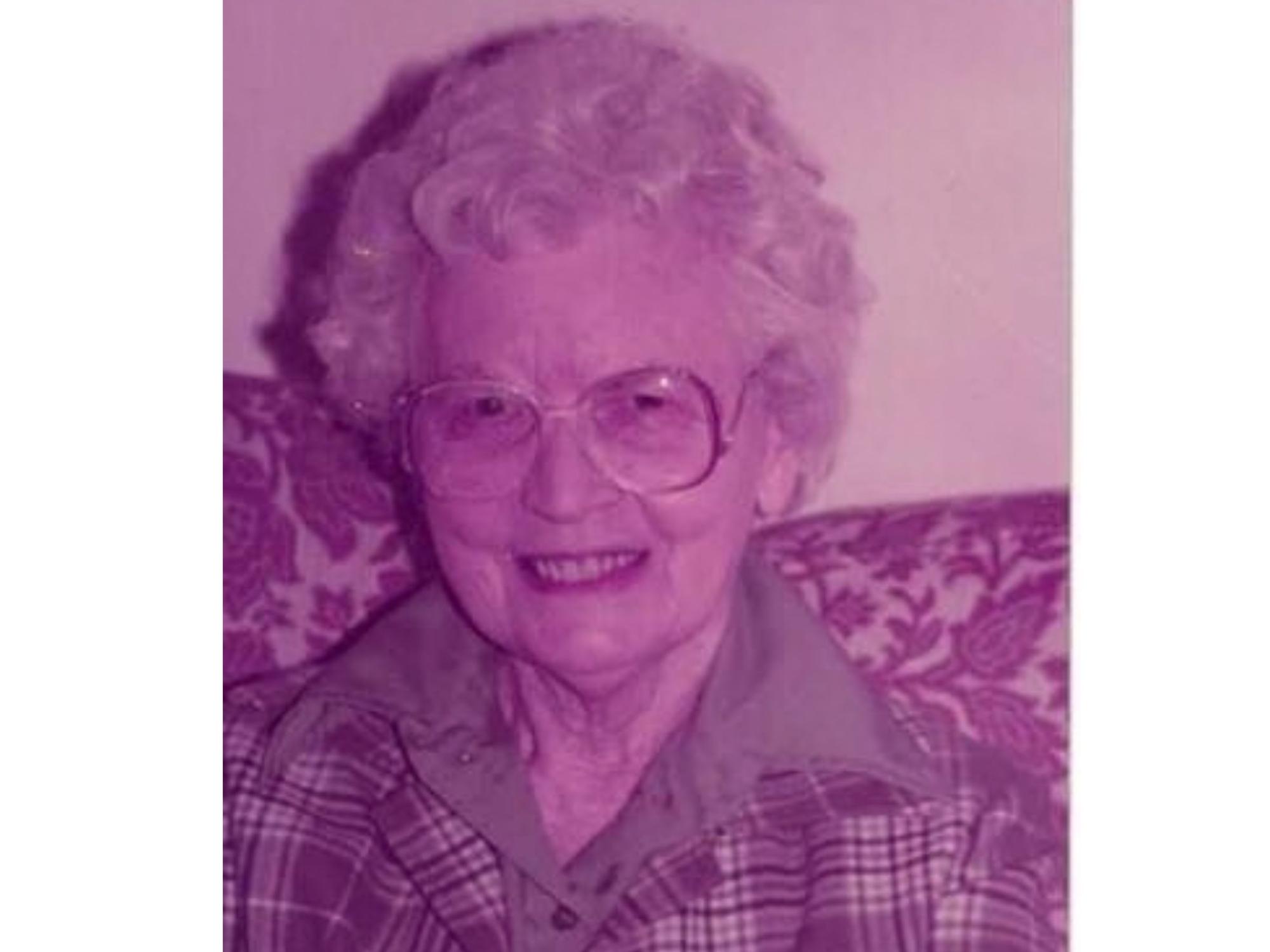 smiling elderly person with glasses