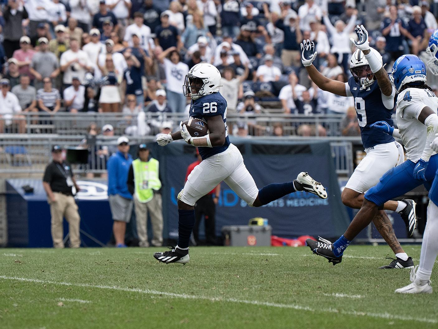Running back races away from defenders