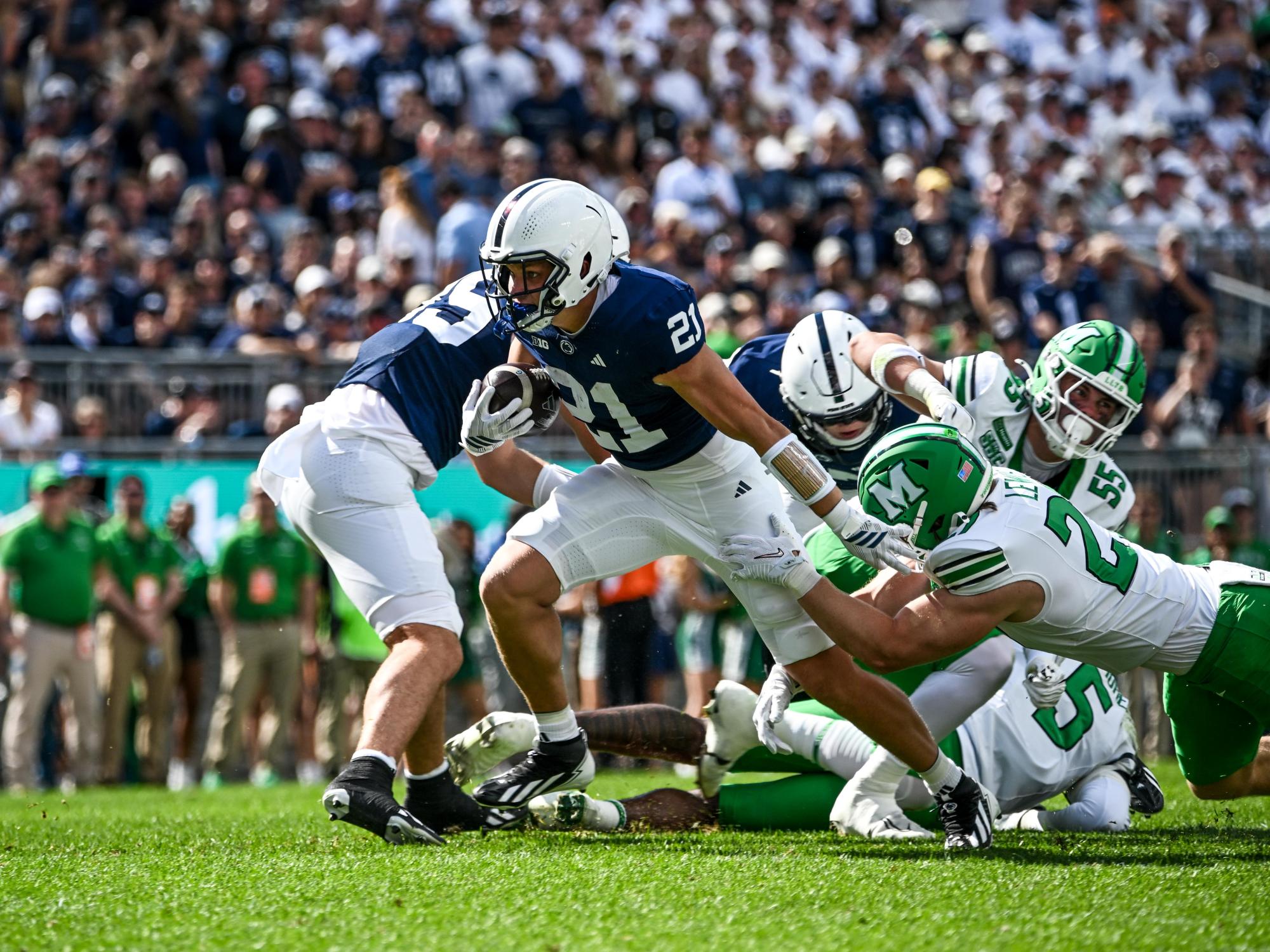 Running back breaks tackle