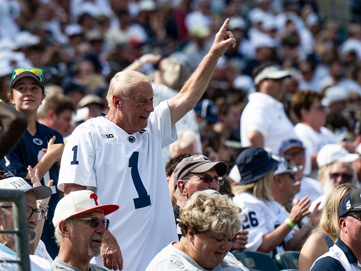 Elderly man cheers