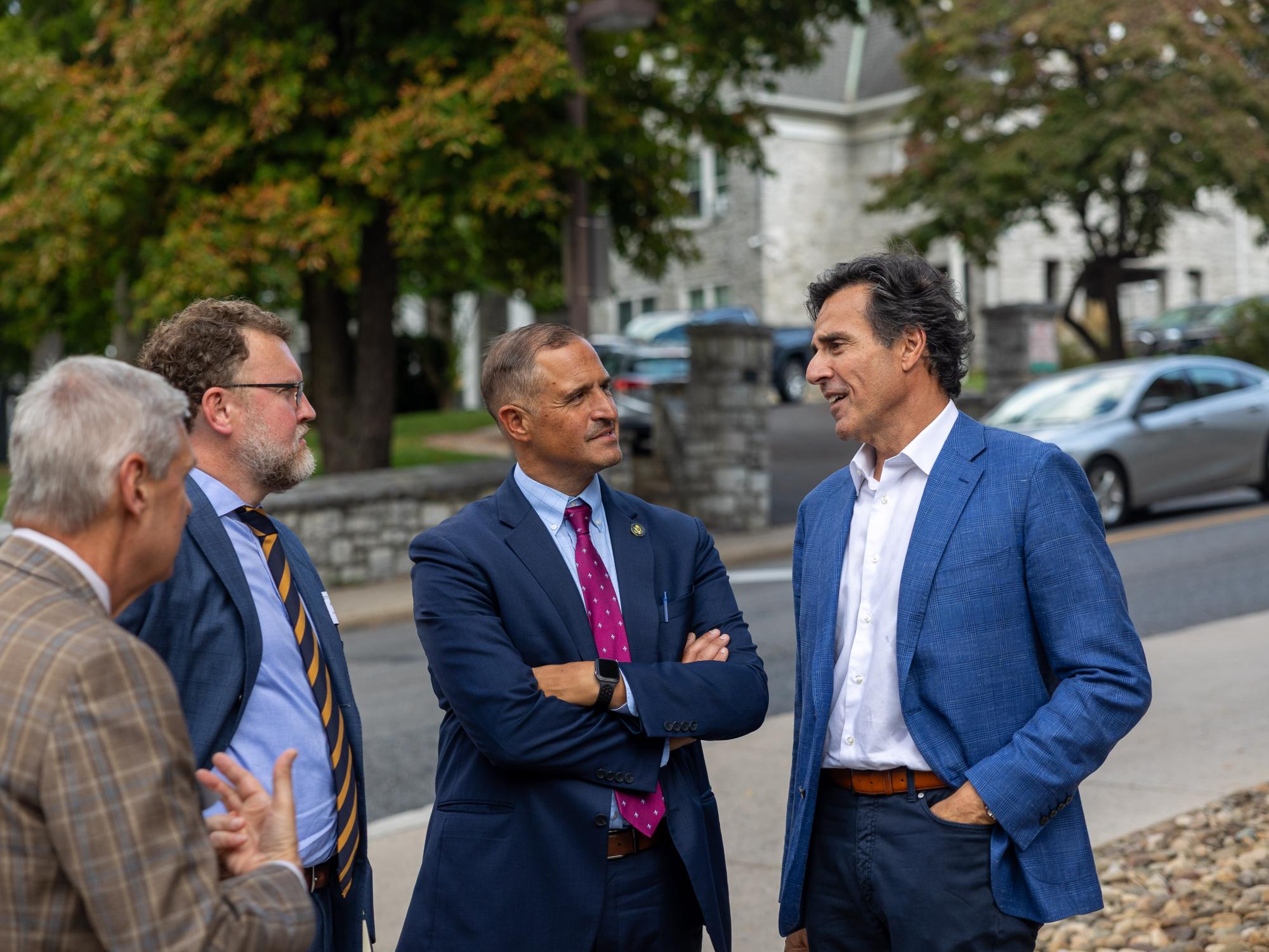 Ara Kervandjian and Joseph DeFelice talking with each other during a tour of the State College Opportunity Zone.
